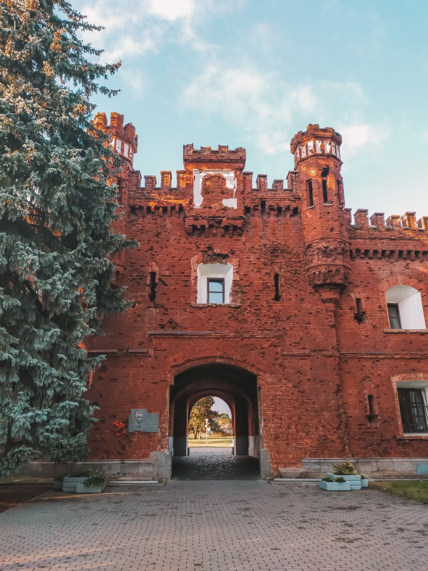 Historic red brick entrance archway of Brest Fortress showing battle-scarred masonry in Belarus