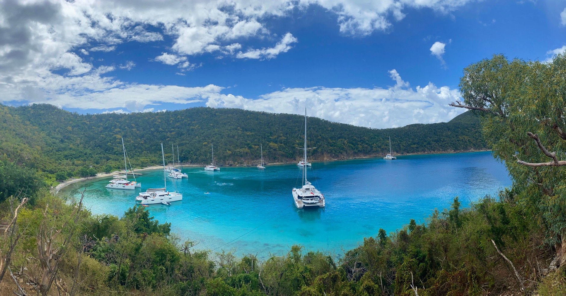 Sailing yachts anchored in the sheltered deep blue waters of Admiralty Bay in Bequia