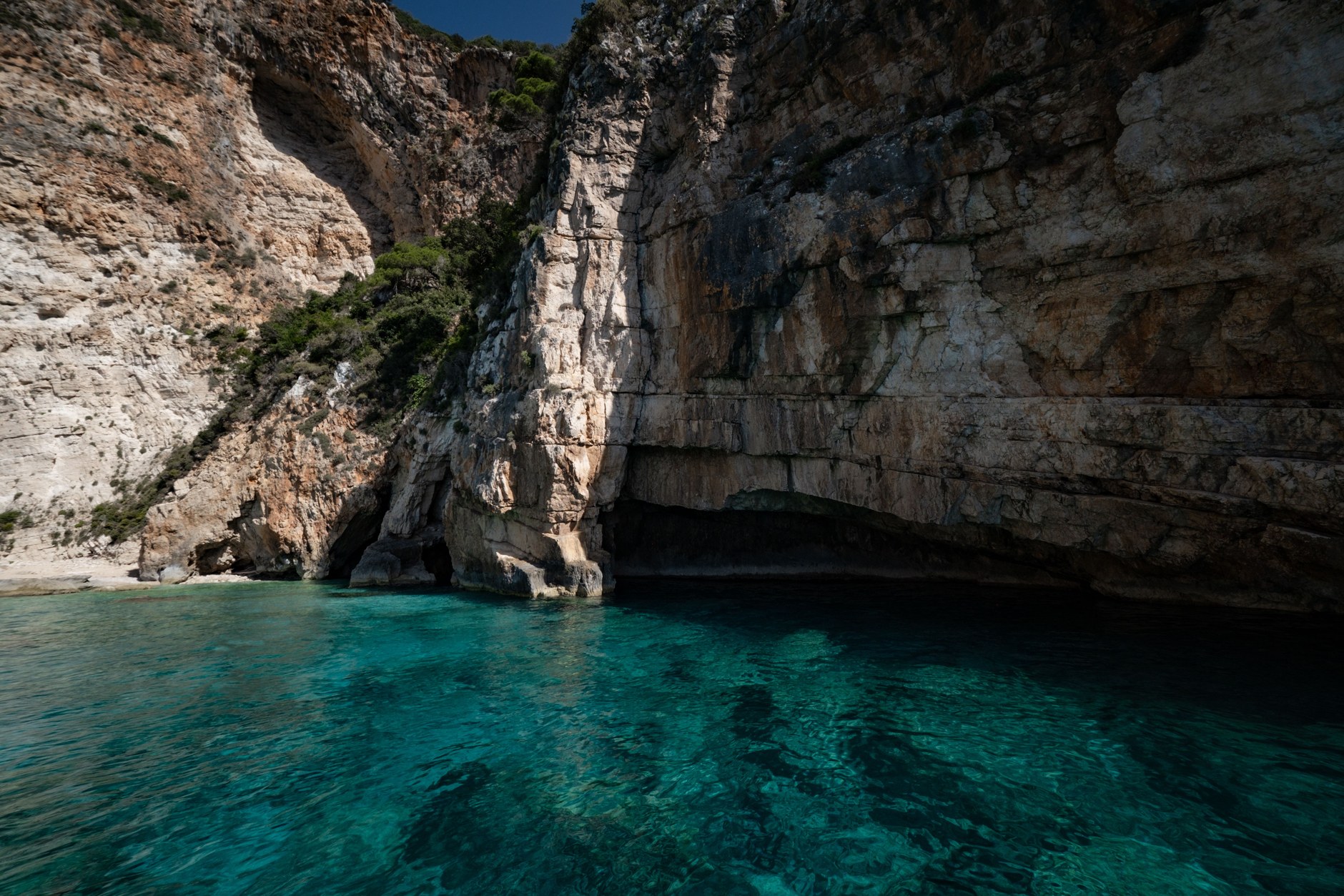 The sheltered turquoise swimming cove of Jobson's Cove enclosed by limestone cliffs