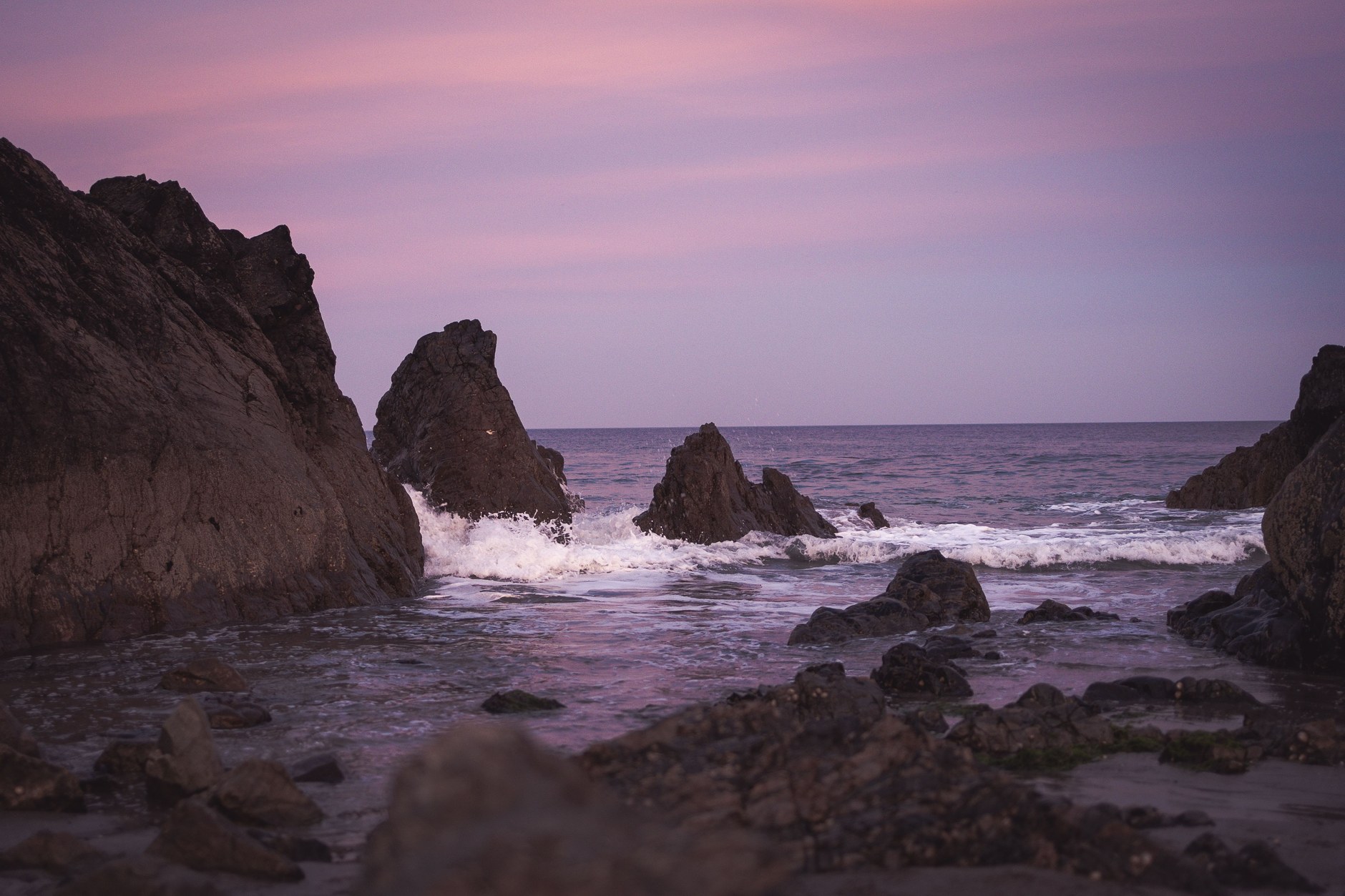 Golden twilight illuminating coastal limestone bluffs along Bermuda's South Shore
