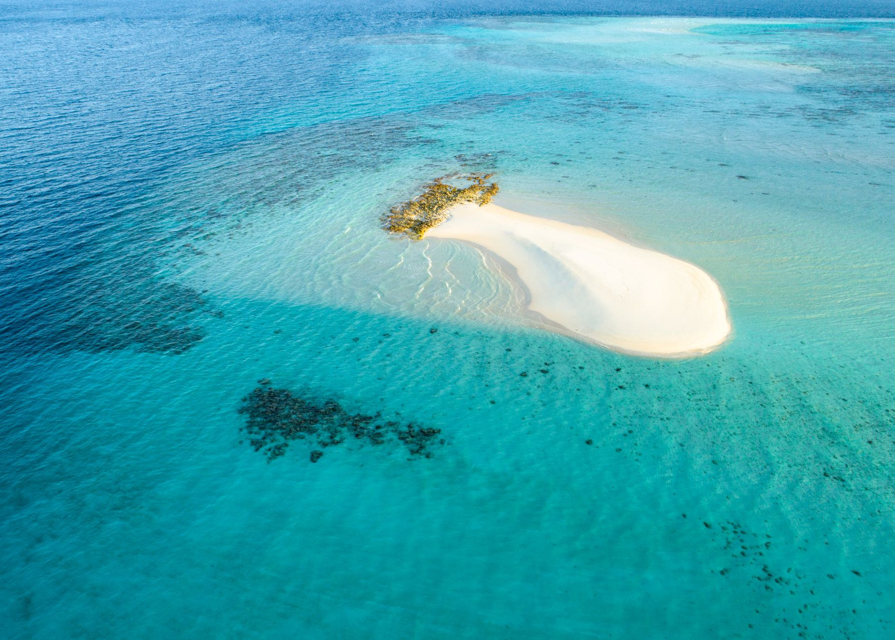 Pristine white sand shore and barrier reef at Anegada