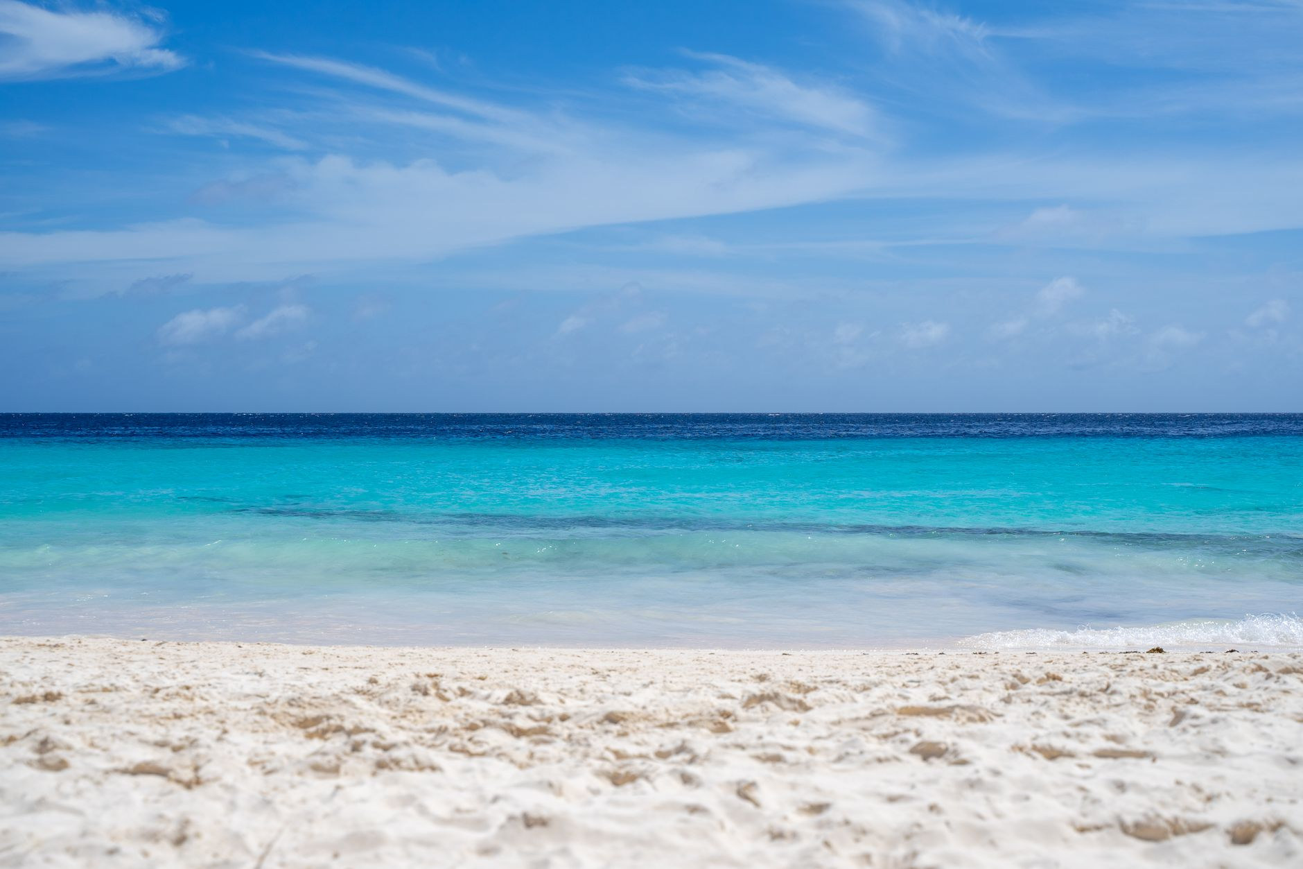 Seven Mile Beach shoreline on Grand Cayman with clear turquoise water