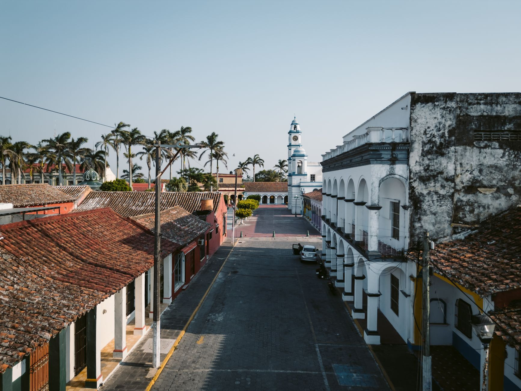 Colonial architecture and towering palms in downtown Cayenne