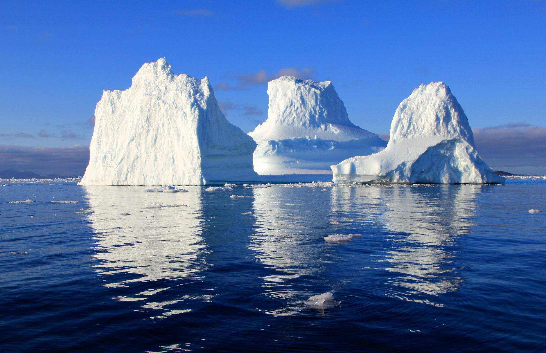 Colossal icebergs drifting through the Ilulissat Icefjord in Disko Bay