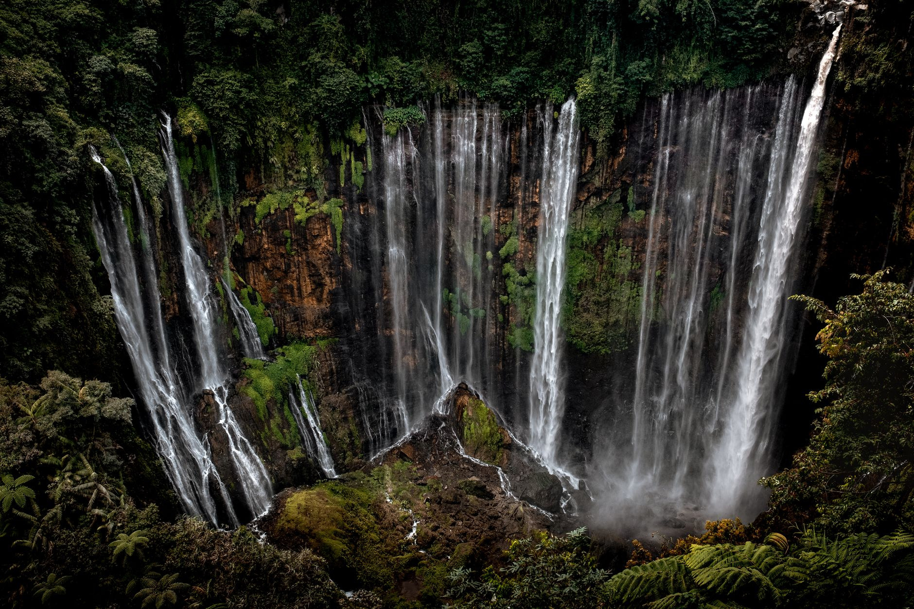 Chutes du Carbet waterfall plunging through the rainforest canopy