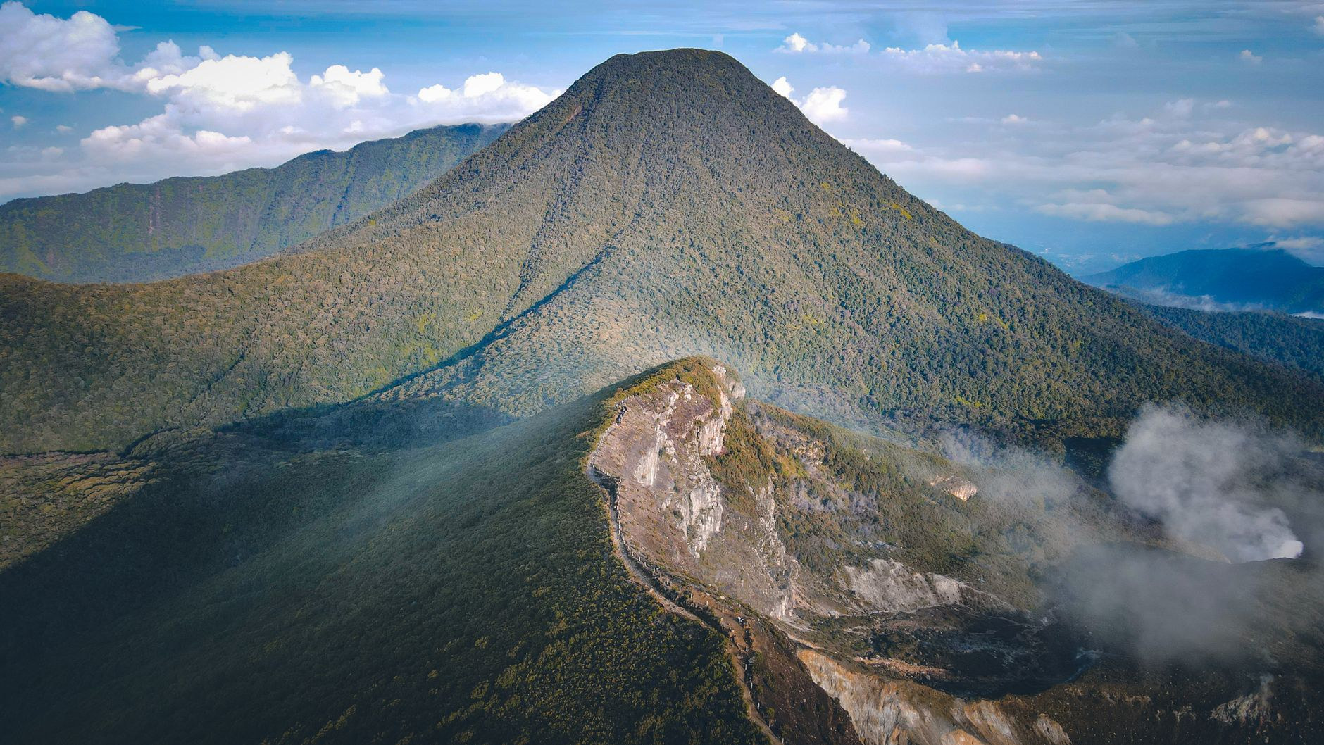Steaming slopes and summit ridge of La Soufrière volcano in Basse-Terre