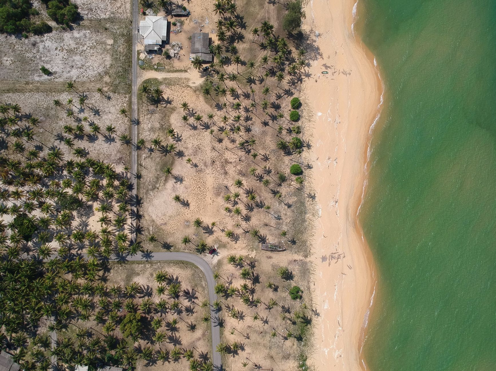 Plage de Grande Anse near Deshaies framed by golden sand and green headlands