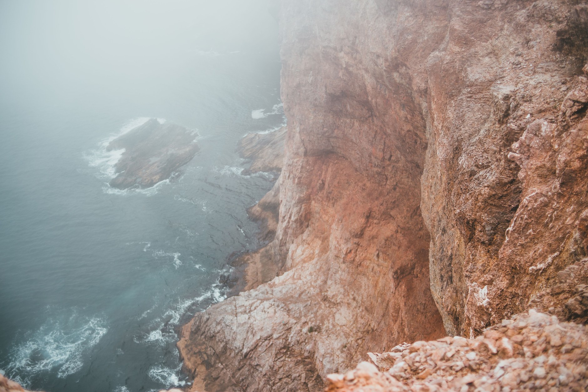 Sheer limestone cliffs plunging into the Pacific at Two Lovers Point