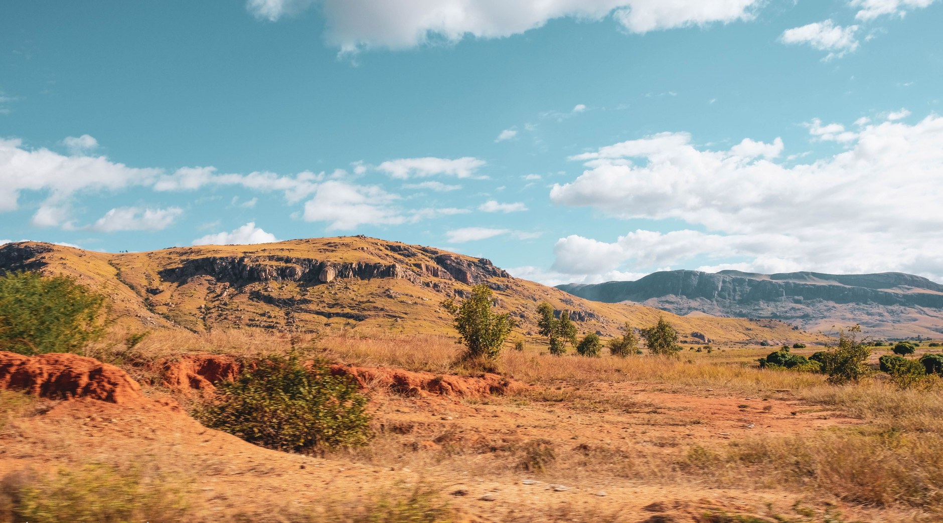 Vast open savannah grasslands leading toward distant mountain ridges in the Rupununi