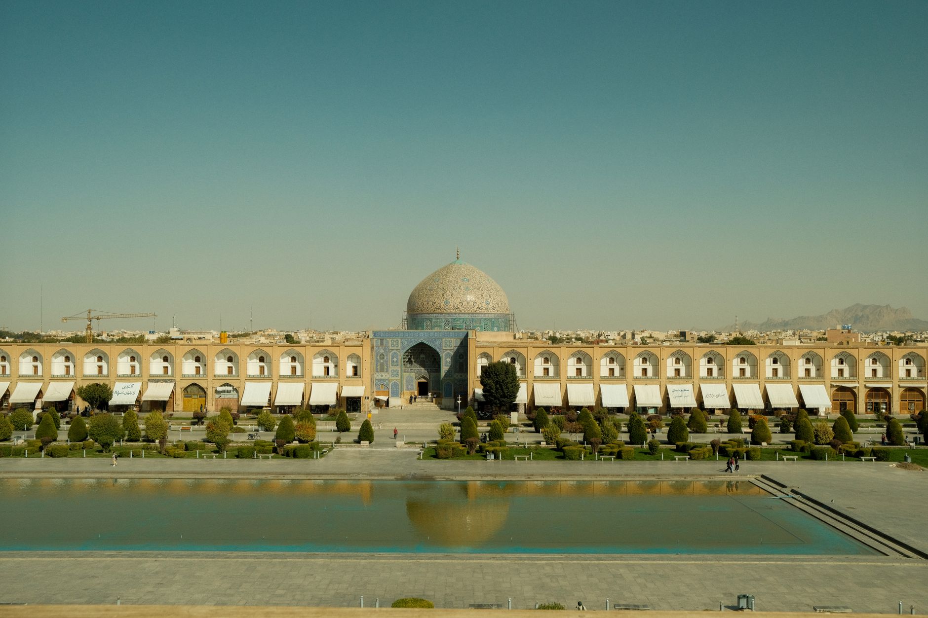 Exquisite cream and caramel tiled dome of Sheikh Lotfollah Mosque overlooking Naqsh-e Jahan Square in Isfahan