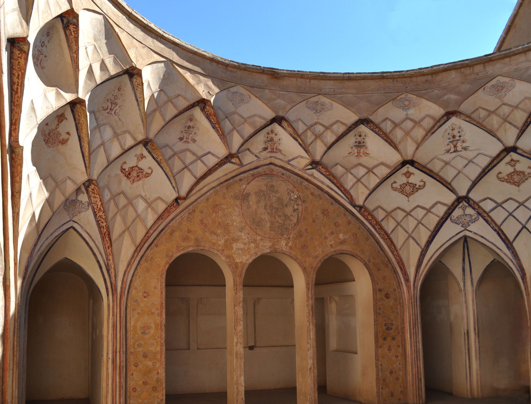 Detailed geometric stucco and painted vaulted ceiling inside the historic Tabatabaei House in Kashan