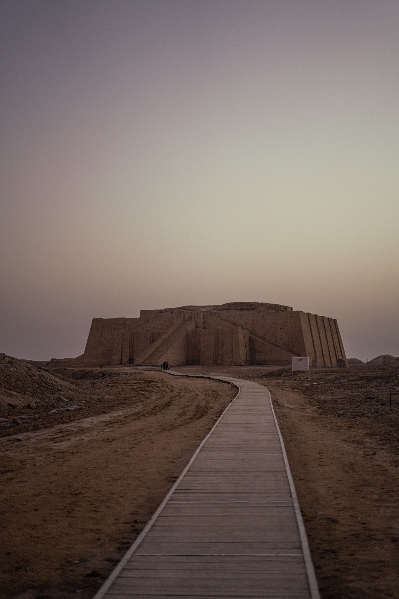 The monumental mud-brick facade and central ceremonial staircase of the Great Ziggurat of Ur in southern Iraq