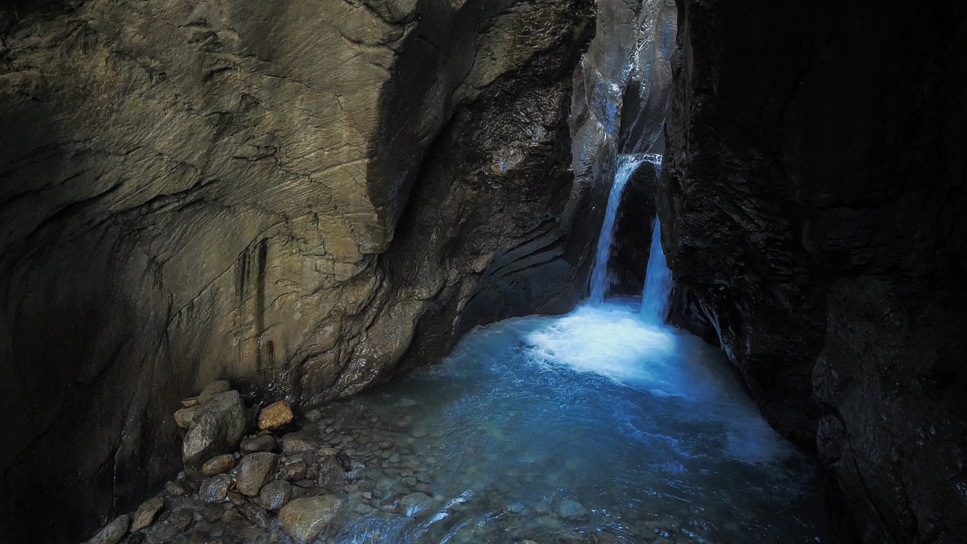 Single unbroken waterfall plunging into a massive sheer basalt canyon gorge near Semonkong