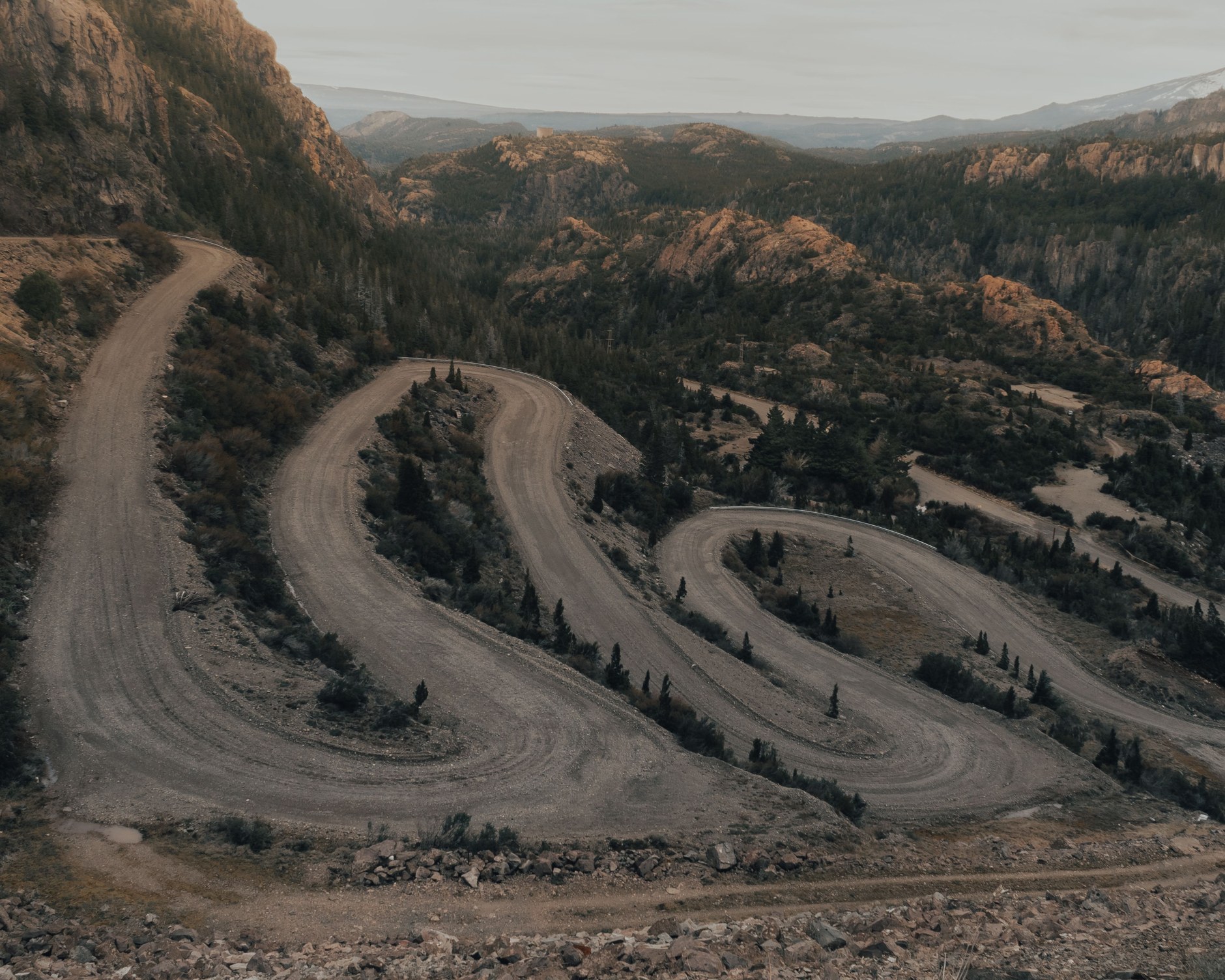 Steep gravel switchbacks and precipitous cliff faces along the iconic Sani Pass road