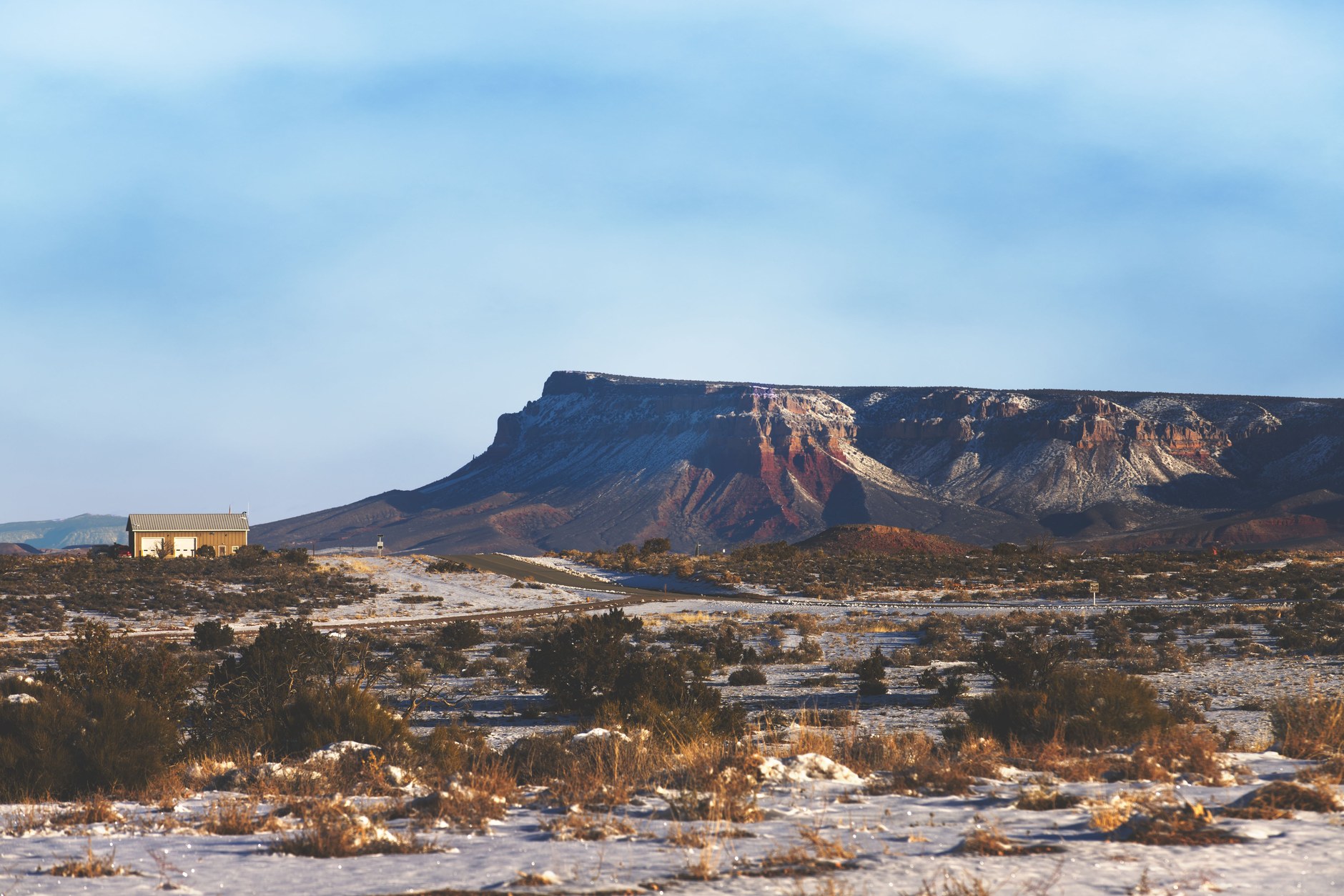 Flat-topped sandstone fortress plateau of Thaba Bosiu against a clear sky