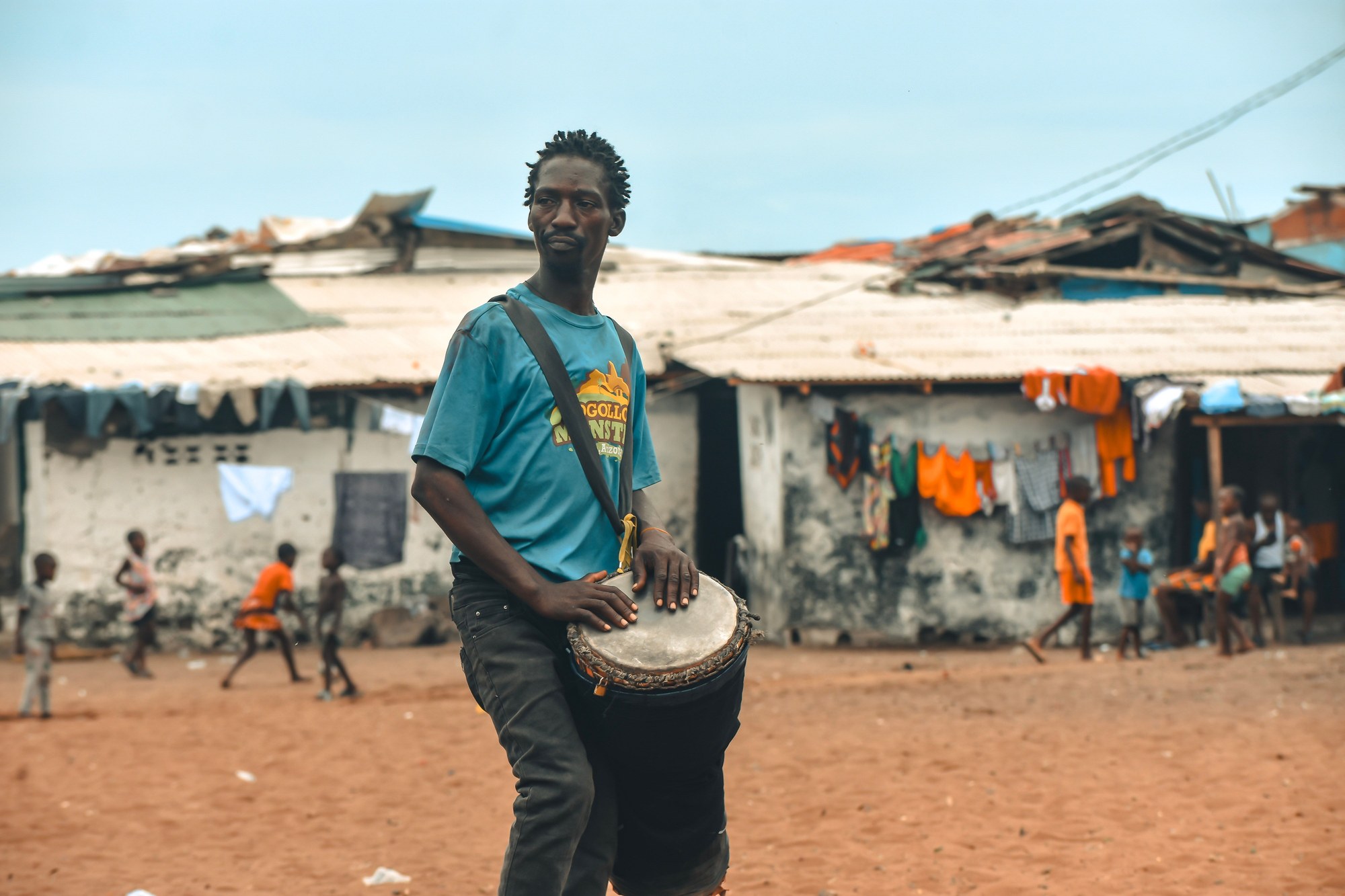Local musician in Monrovia playing traditional African drums during an energetic cultural performance
