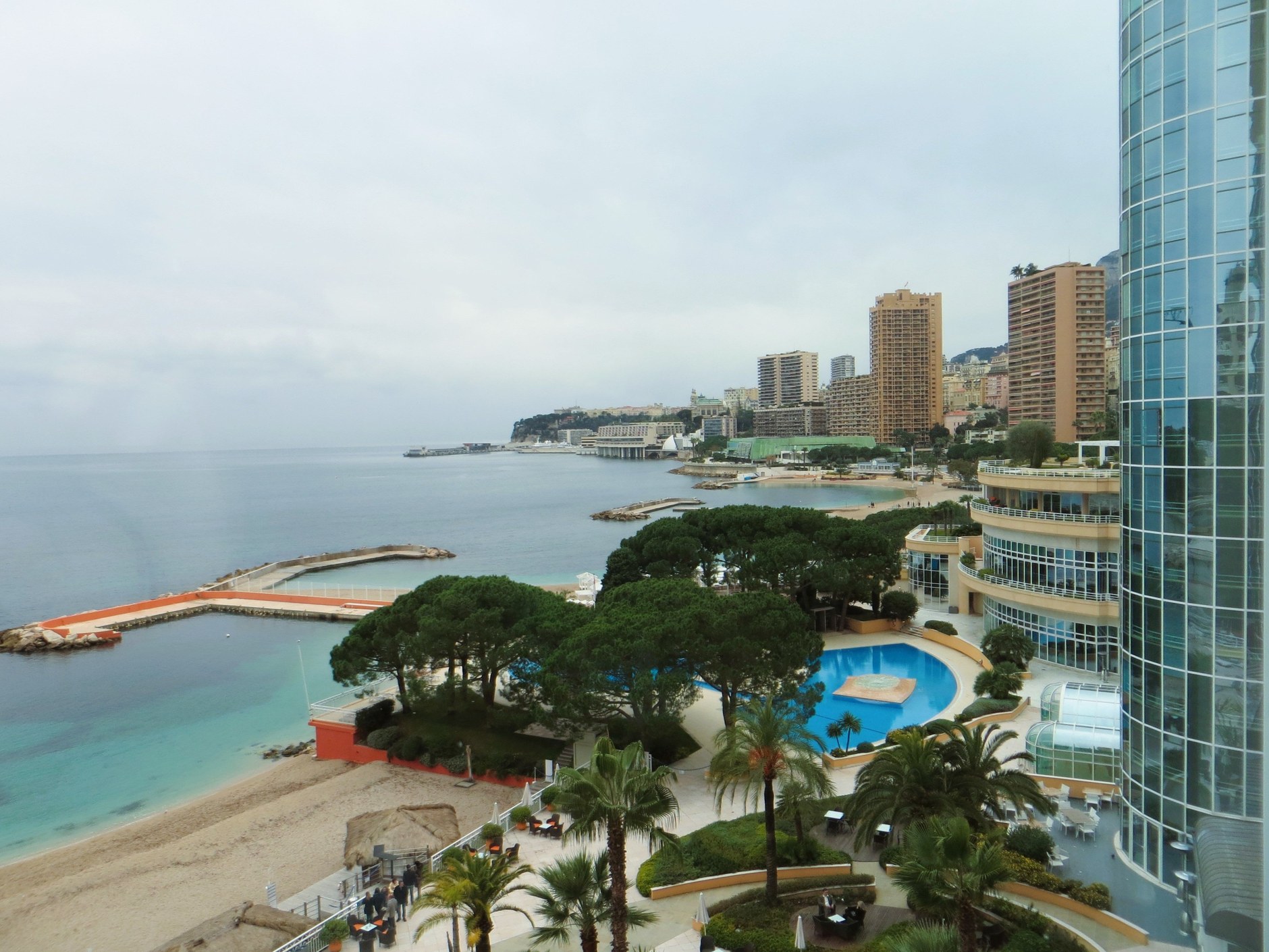The Mediterranean promenade and pebble shoreline at Larvotto beach