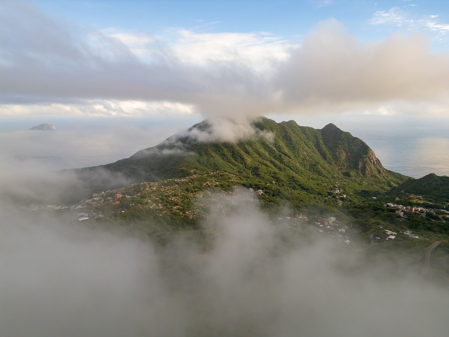 Steep volcanic ridges and misty cloud forest covering the summit slopes of Mount Scenery on Saba