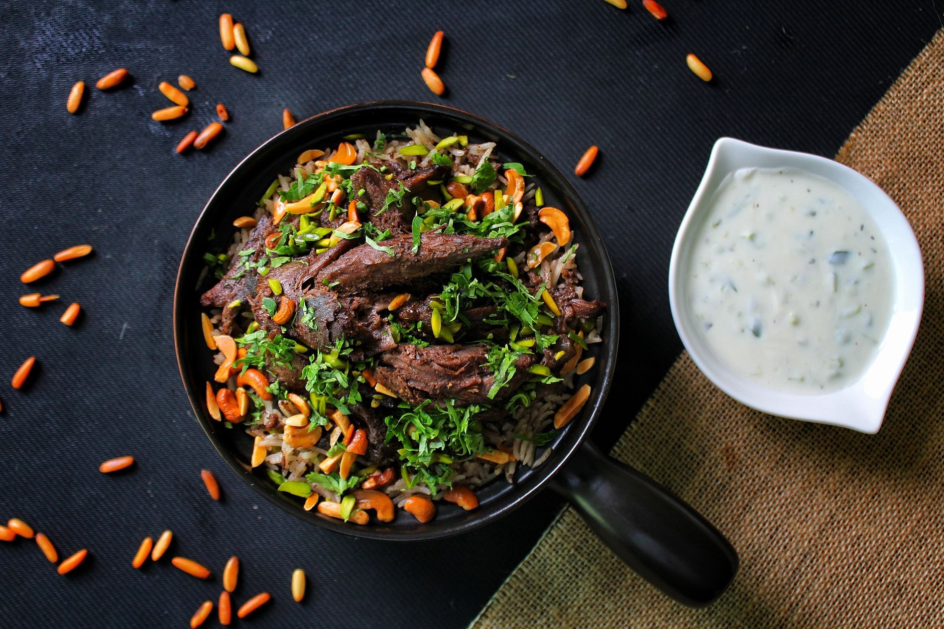 Traditional Albanian Tavë Kosi baked lamb casserole with rice eggs and savory yogurt baked golden in a clay dish