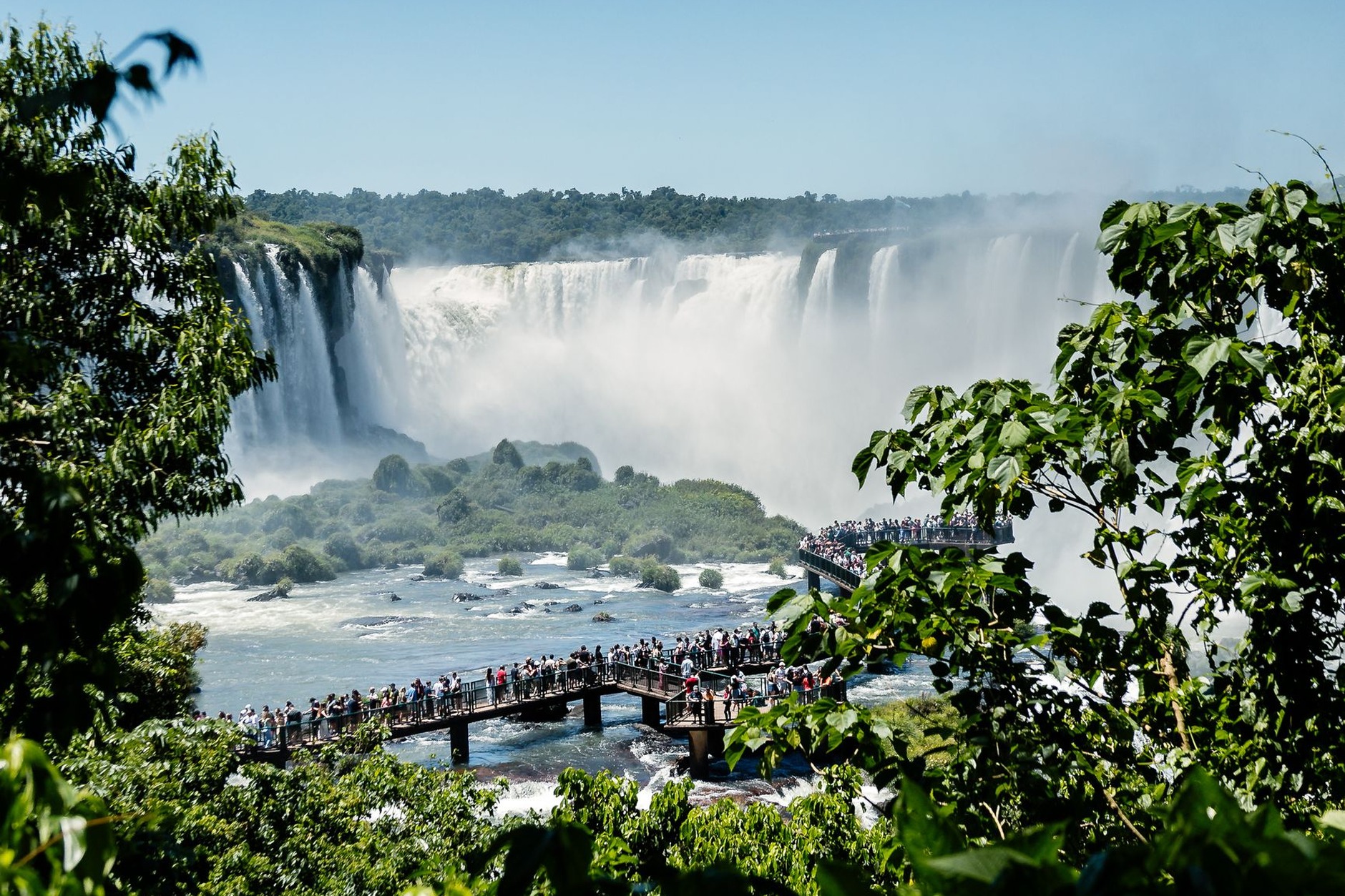 Thundering curtain of water plunging into the mist-shrouded chasm of Devil's Throat at Iguazú National Park