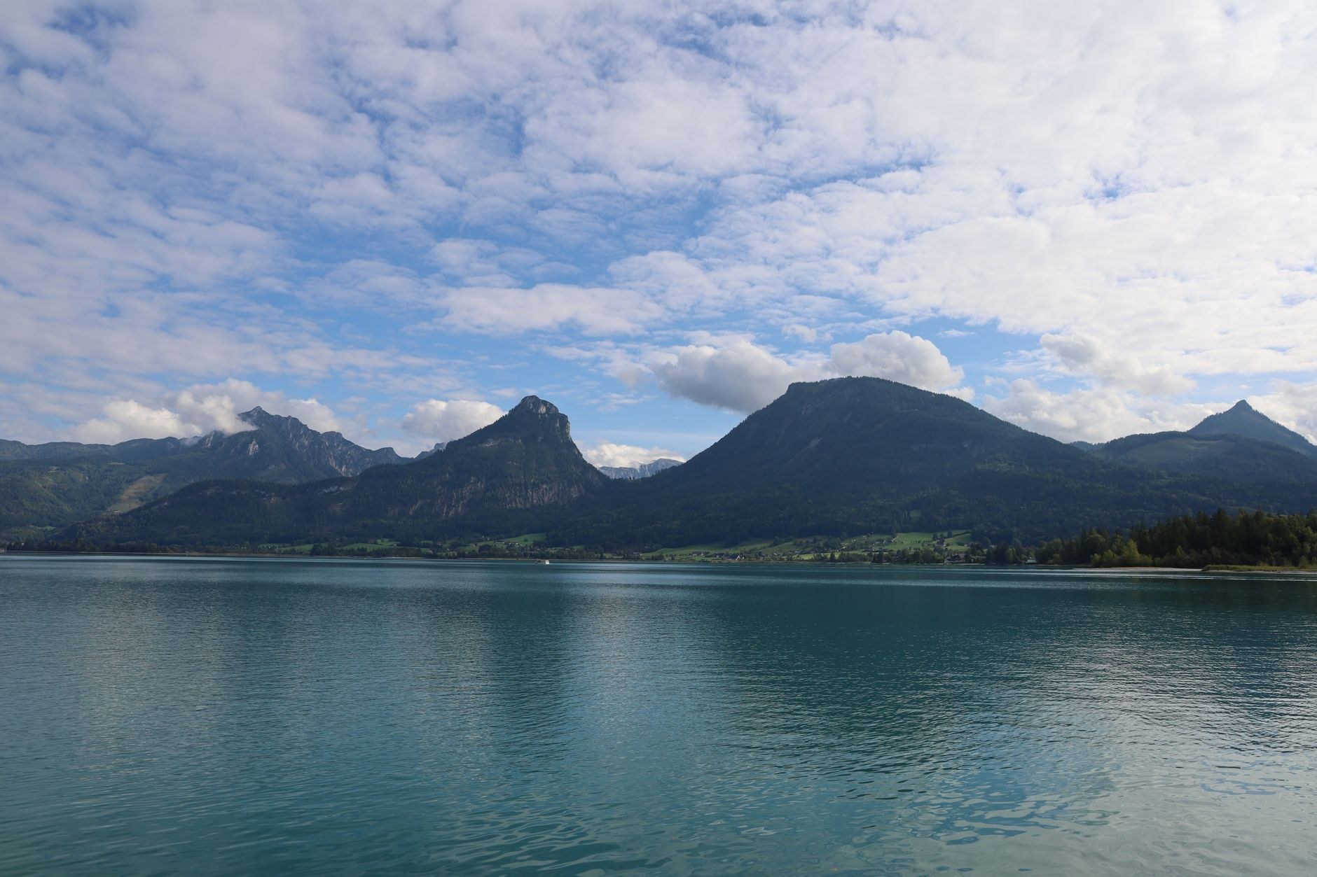 Lake Wolfgangsee in the Salzkammergut providing a tranquil mountain retreat surrounded by green alpine meadows