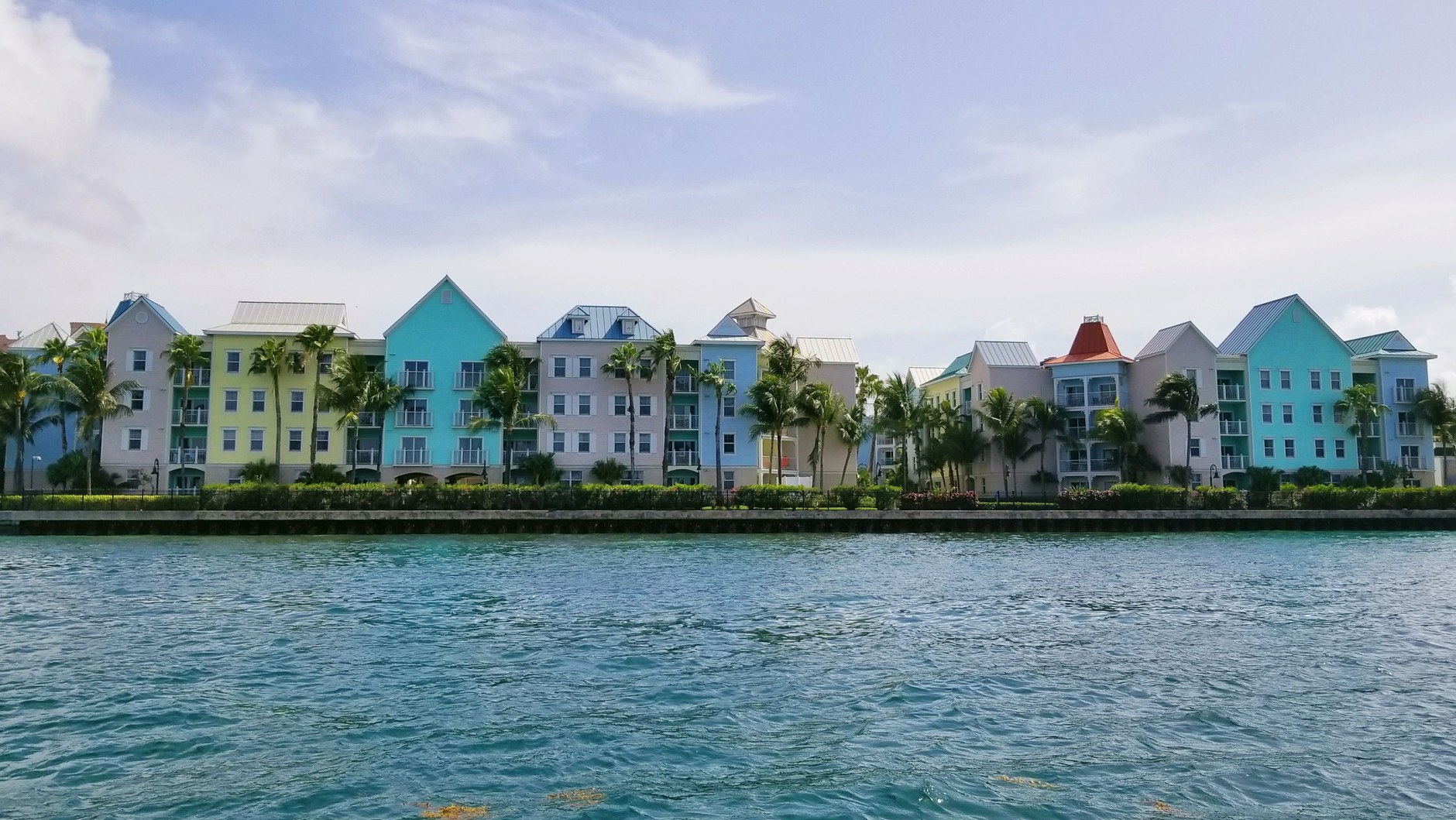 Colonial-era pastel buildings and waterfront promenade along the harbour in Nassau