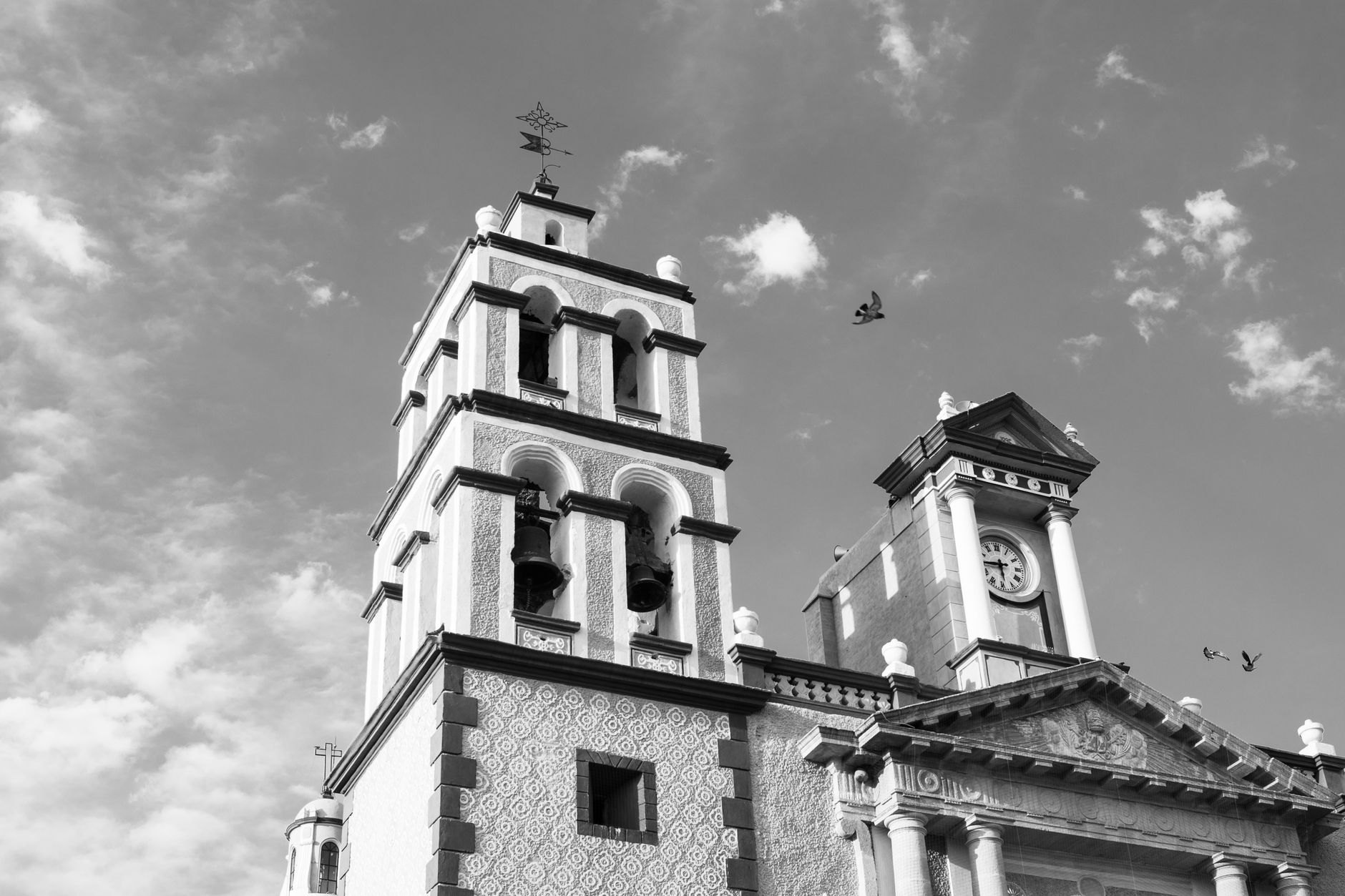 Victorian neo-Gothic coral-limestone Parliament Buildings and clock tower overlooking the waterfront Careenage harbor