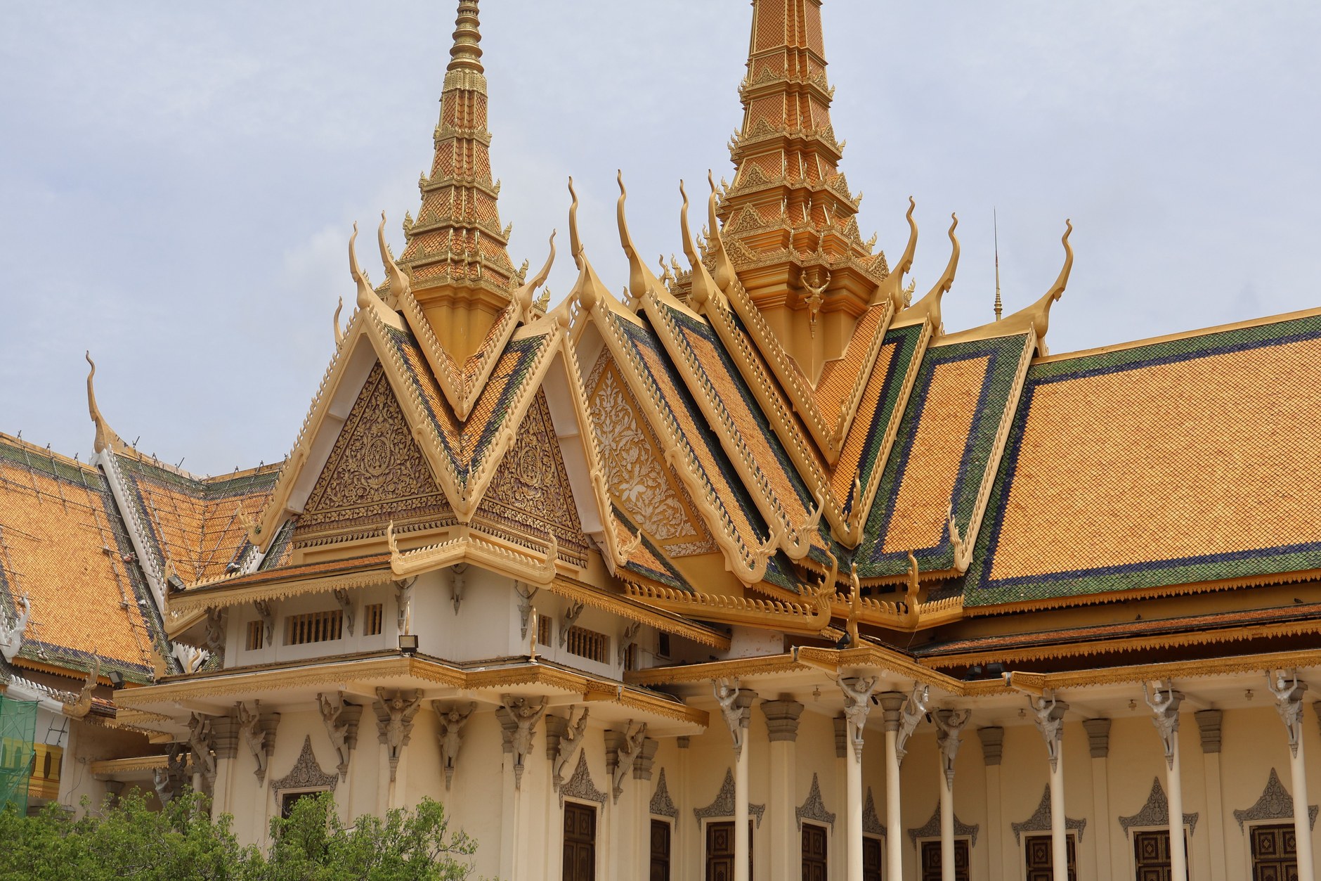 Gilded spires and classic Khmer architecture of the Royal Palace Throne Hall in Phnom Penh