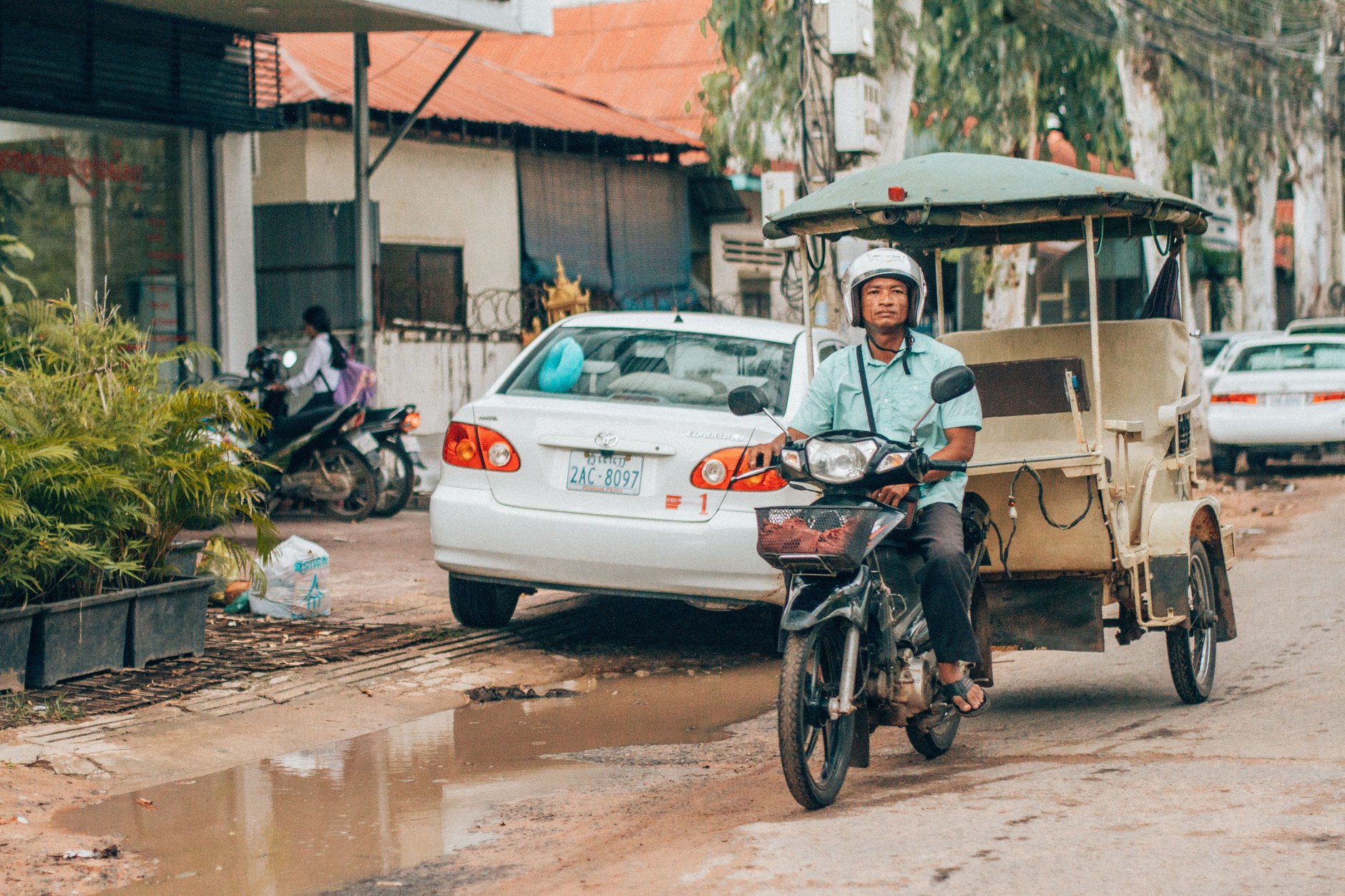 A traditional motorized remork tuk-tuk navigating the streets of Siem Reap