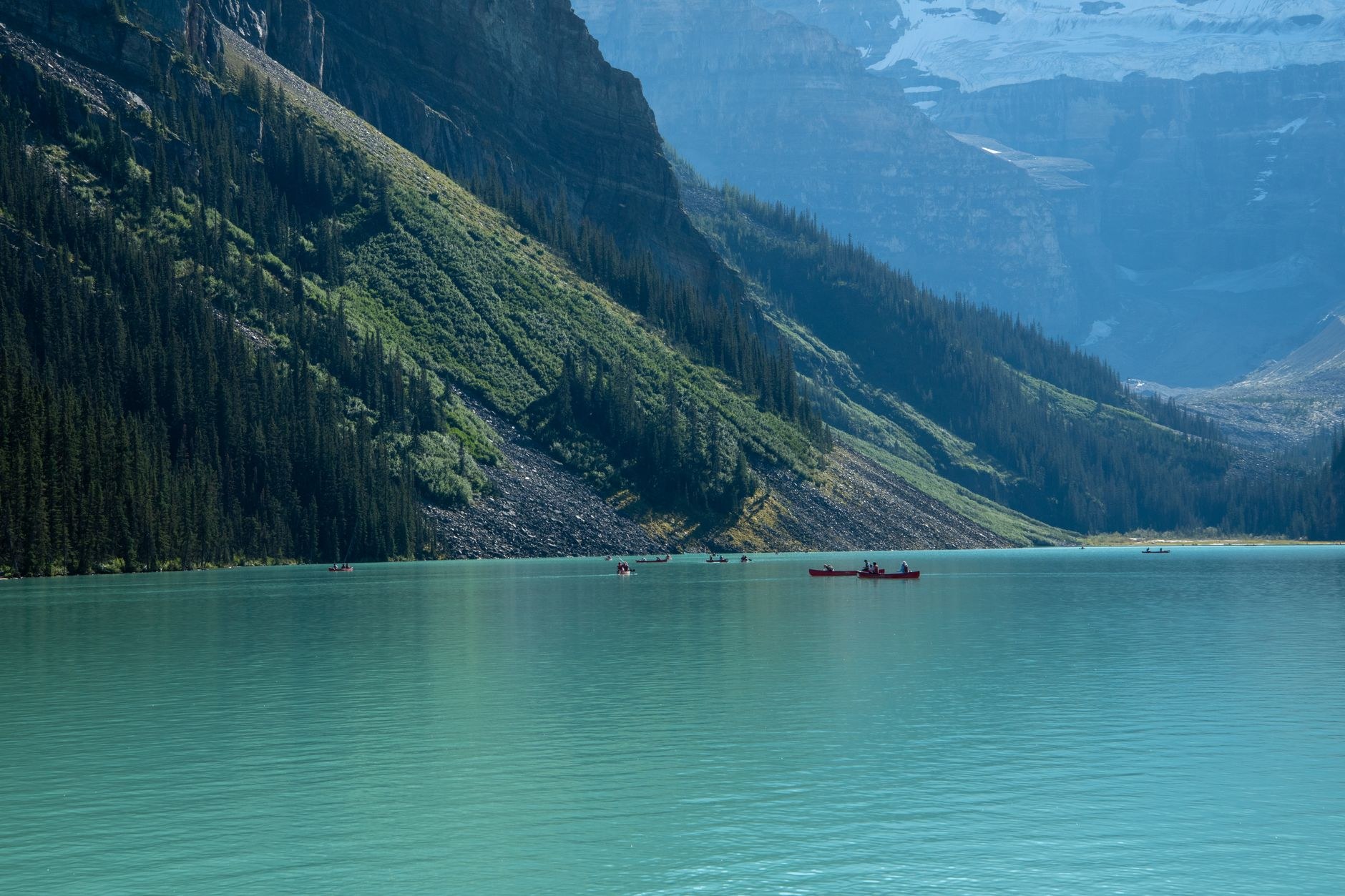 Iconic turquoise waters of Lake Louise framed by glaciated Rocky Mountain peaks