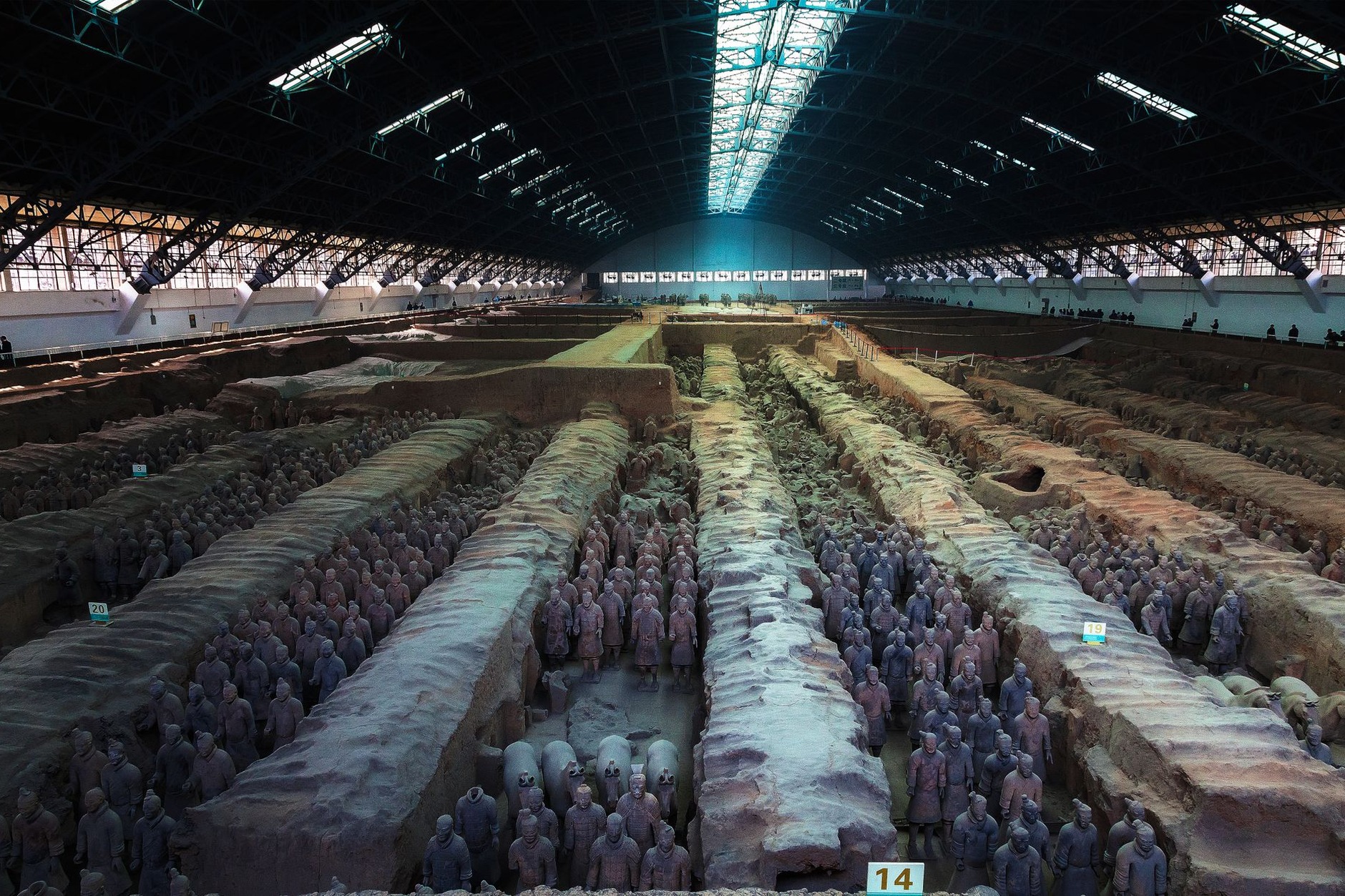 Thousands of life-sized terracotta soldiers standing in battle formation in Pit 1 at the Mausoleum of the First Qin Emperor