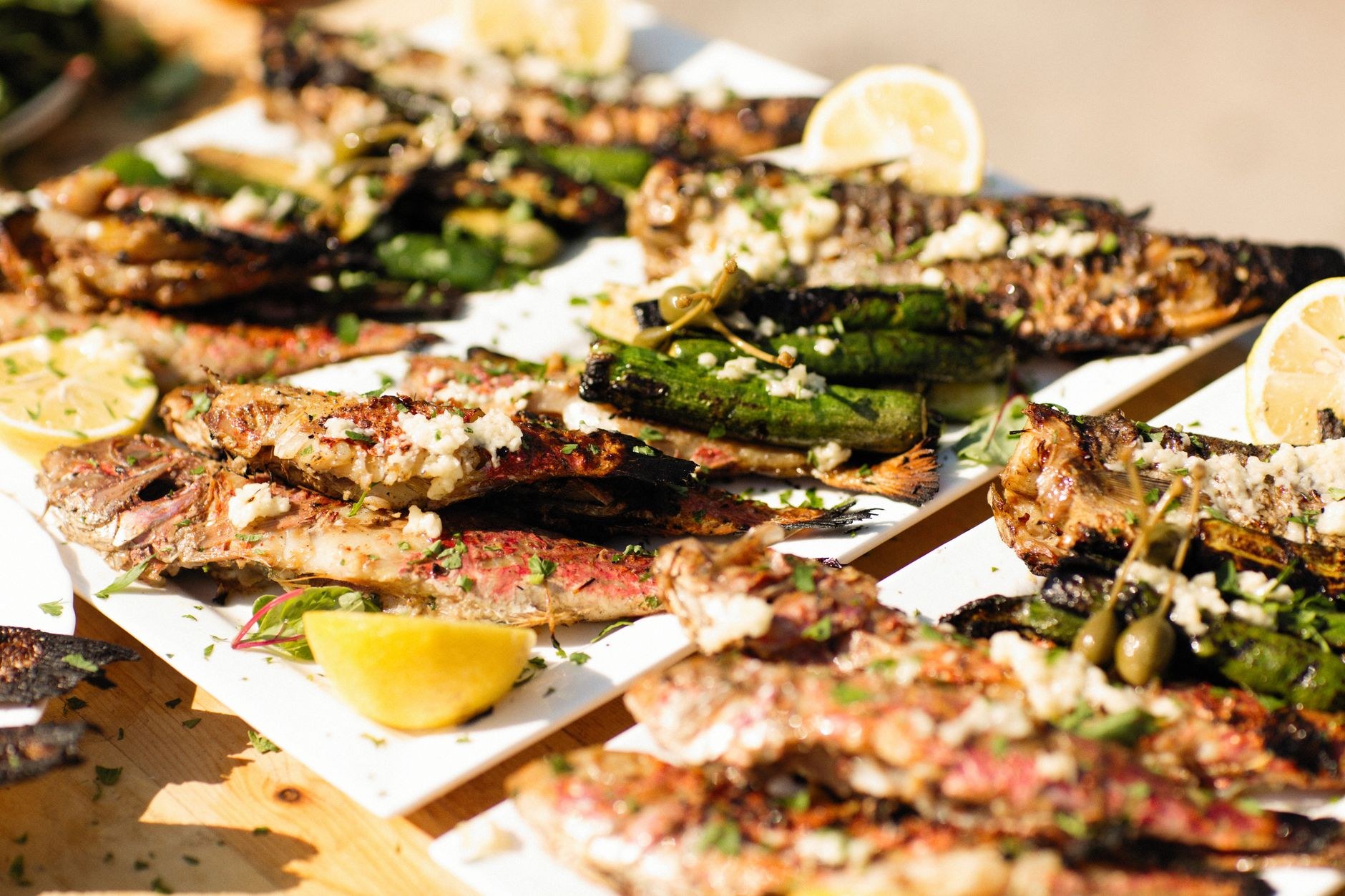 Freshly grilled Adriatic white fish drizzled with extra virgin olive oil, garlic, and fresh lemon