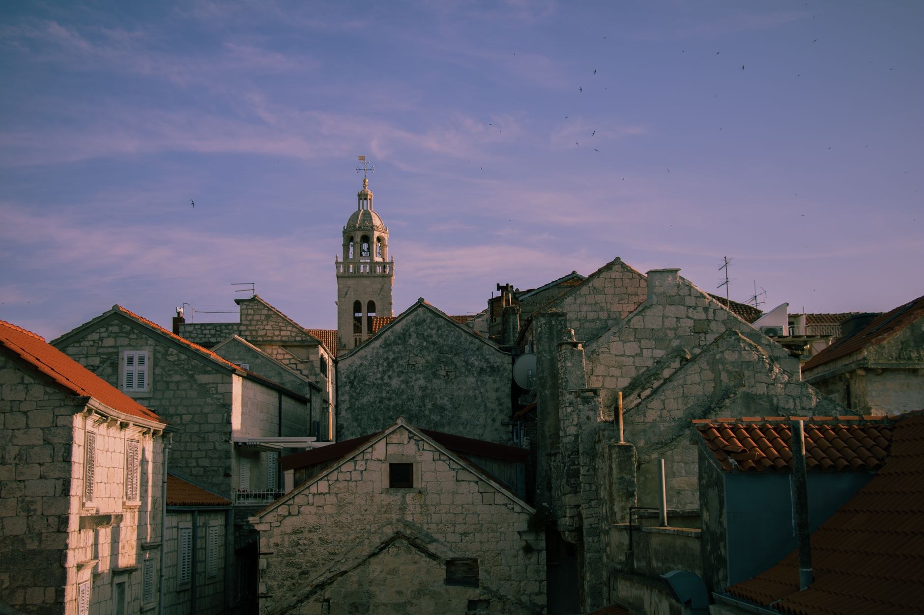 Walled medieval peninsula town of Korčula projecting into deep blue coastal waters