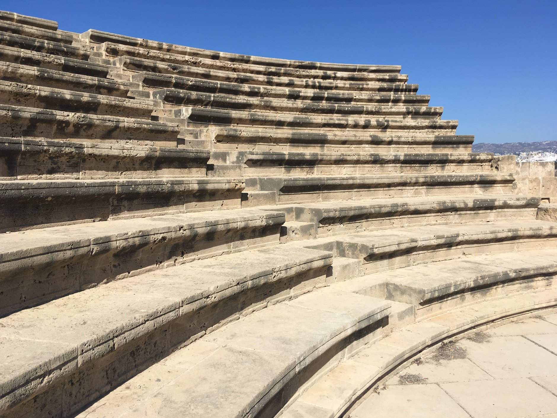 Ancient Greco-Roman amphitheater of Kourion perched on a high coastal cliff overlooking the Mediterranean sea in Episkopi Bay