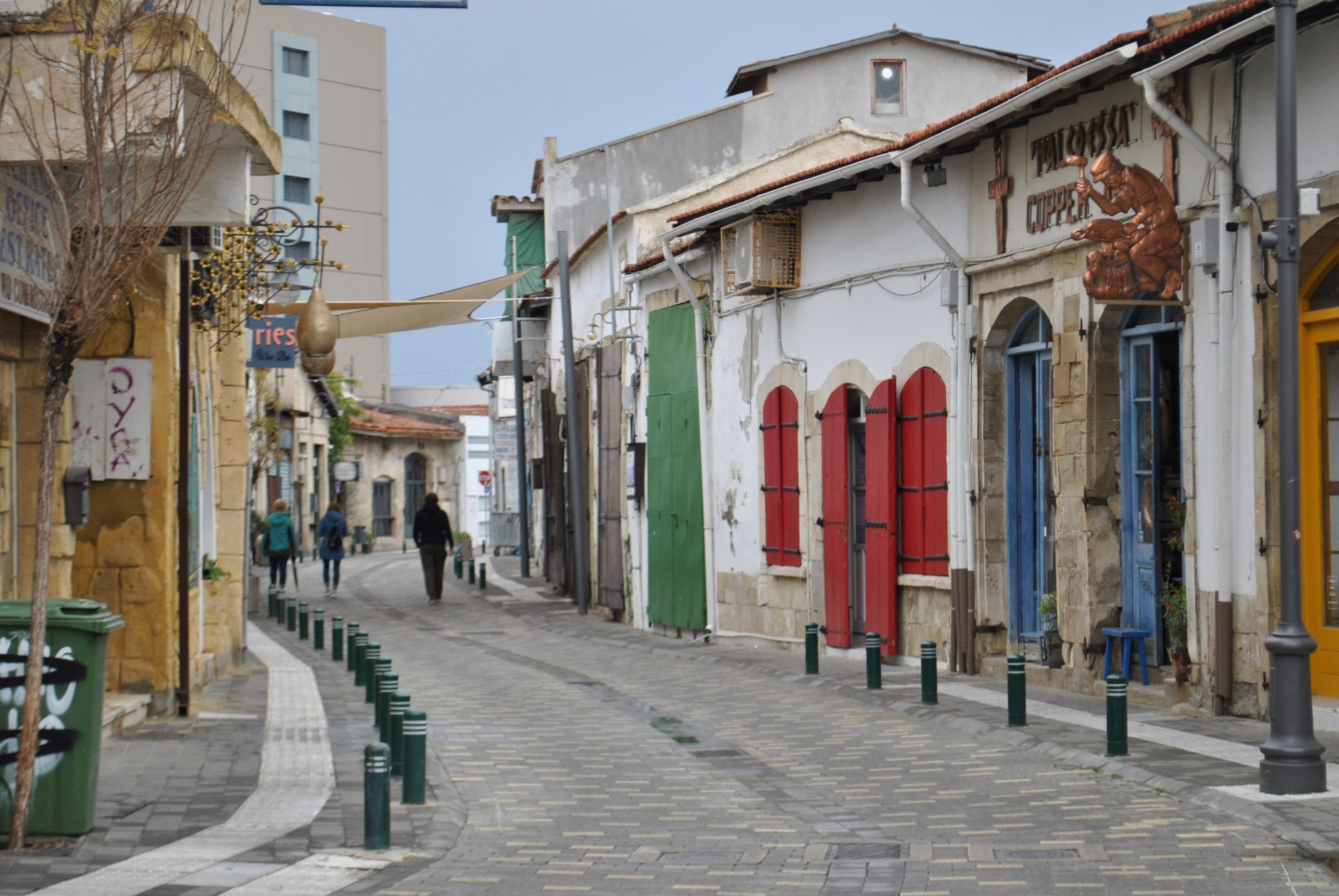Historic sandstone pedestrian street with outdoor cafes and restored shutters in the historic walled old town of Nicosia
