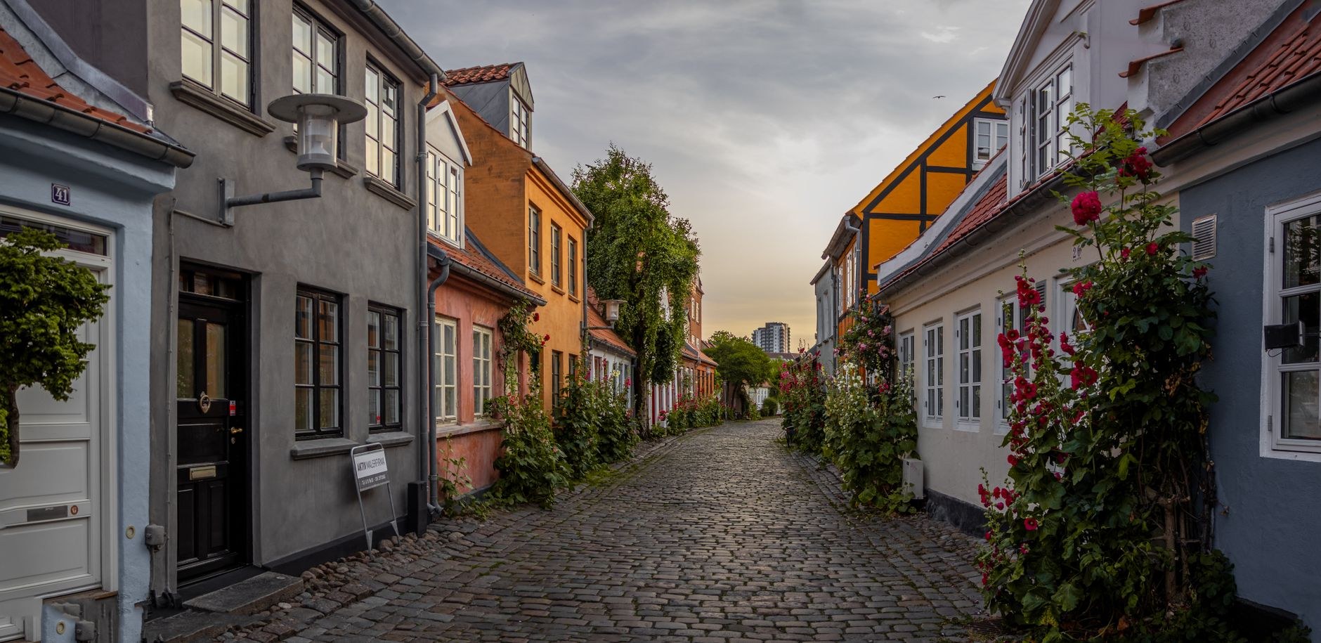 Restored half-timbered merchant buildings and stone alleys at Den Gamle By open-air museum in Aarhus