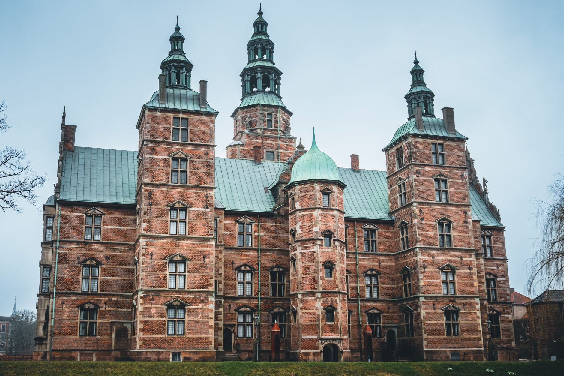 Renaissance red-brick facade and spires of Rosenborg Castle surrounded by the King's Garden in Copenhagen