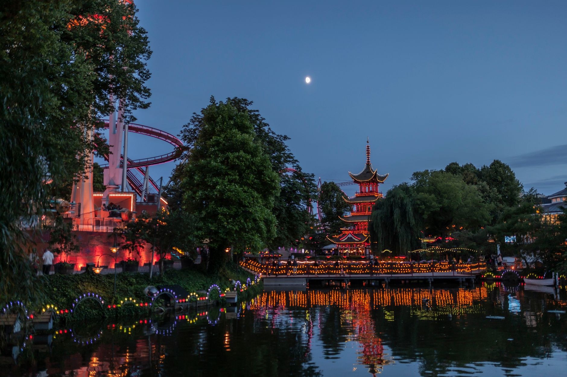 Illuminated Moorish pavilion and historic amusement grounds at Tivoli Gardens in central Copenhagen