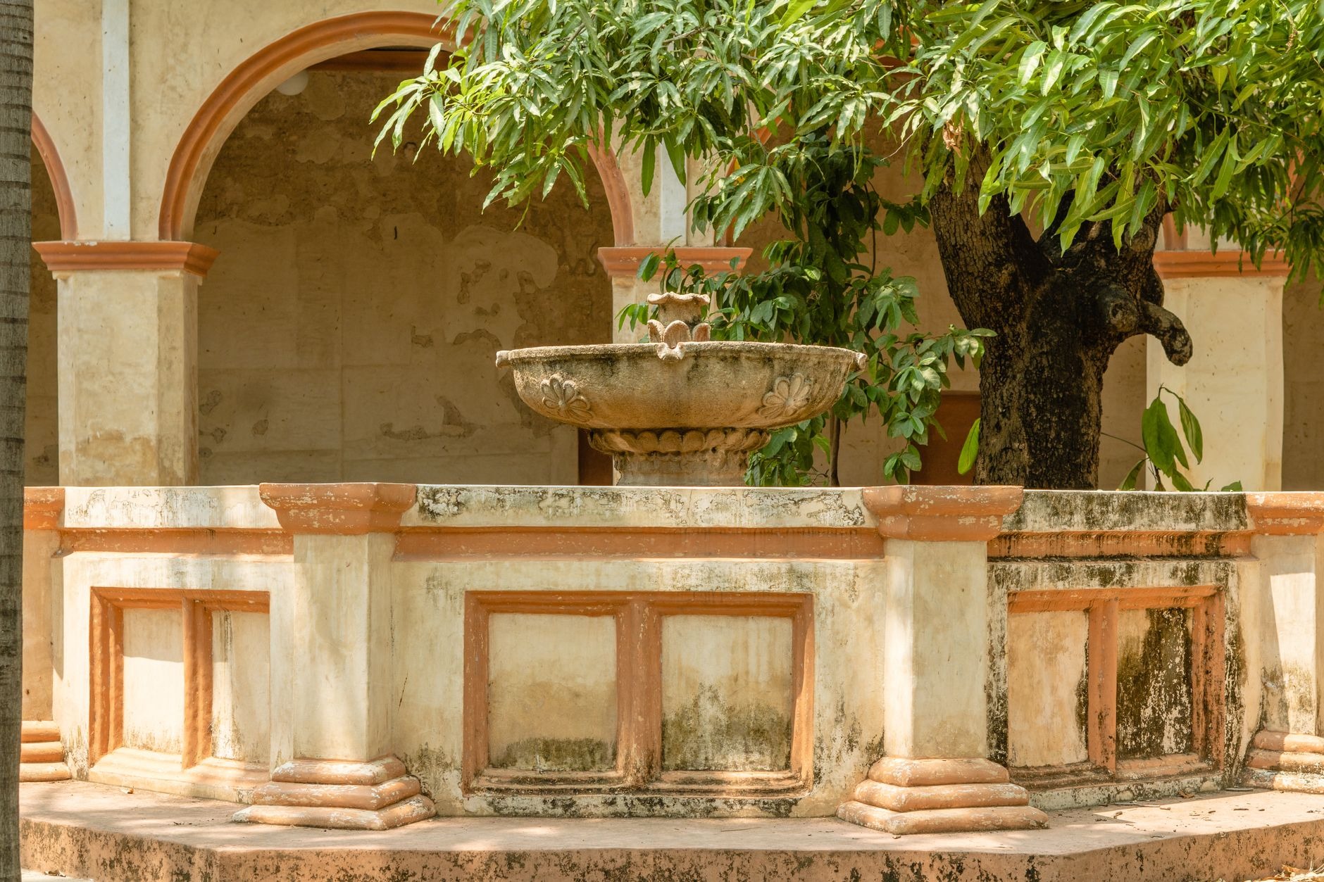 Gothic-Mudéjar stone arches of the Alcázar de Colón viceregal palace in the historic Colonial Zone of Santo Domingo