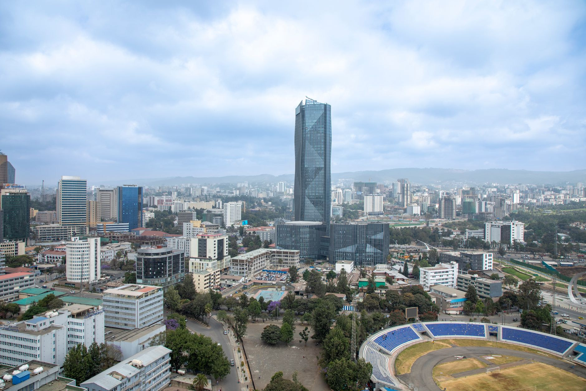 Aerial perspective over Addis Ababa financial district featuring modern high-rise architecture and expansive highland cityscape