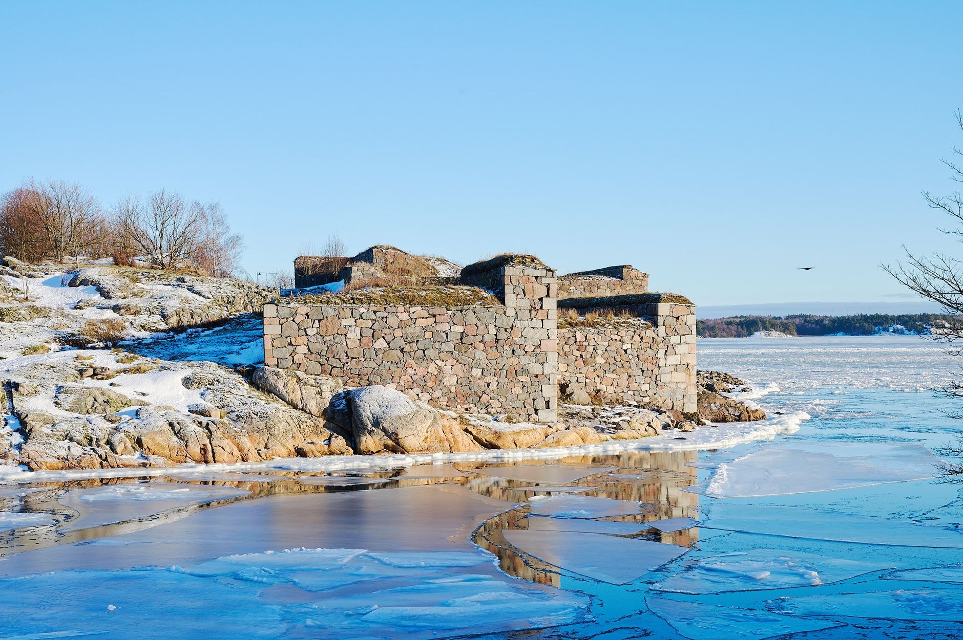Granite coastal bastions and maritime artillery overlooking the Gulf of Finland at Suomenlinna sea fortress