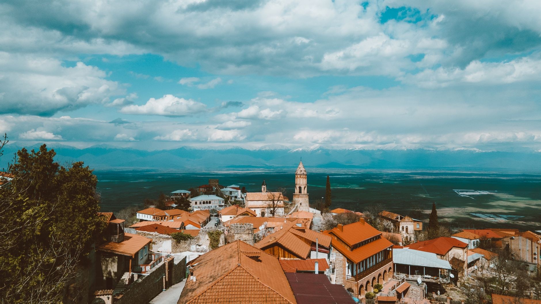 Fortified defensive walls and watchtowers of Sighnaghi overlooking the vast vineyards of the Alazani Valley in Kakheti