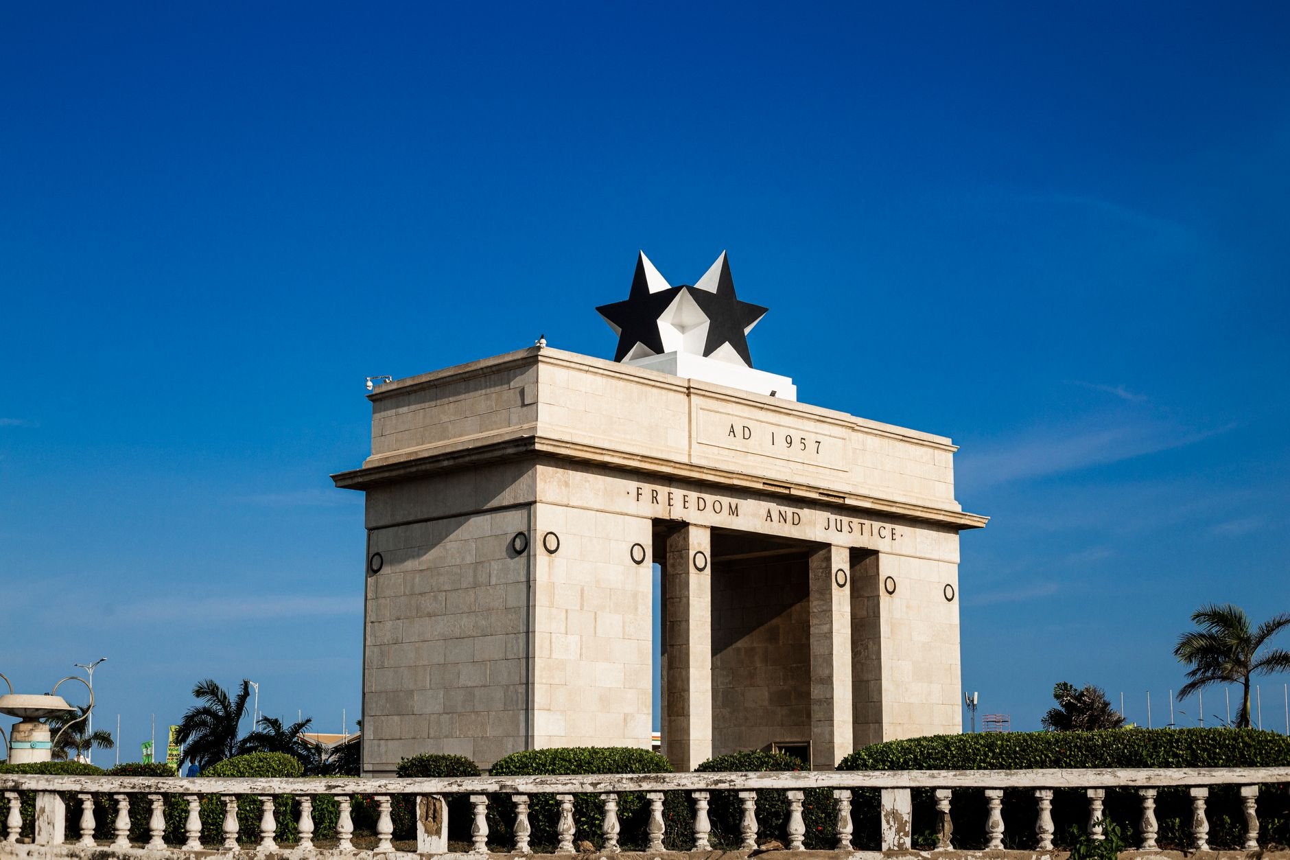 Monolithic stone archway of the Black Star Gate topped by a prominent black star in Independence Square in central Accra
