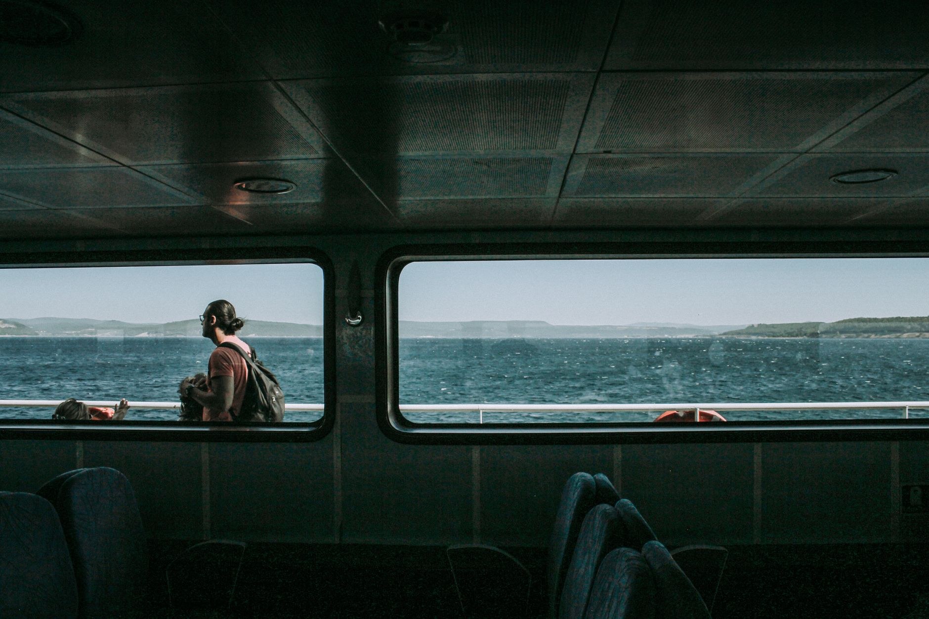 Passenger ferry sailing across the deep blue waters of the Aegean Sea