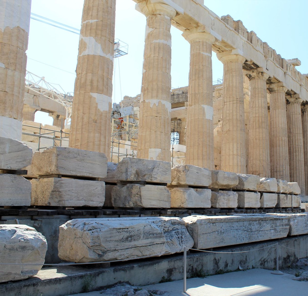 Ancient marble columns of the Parthenon temple atop the rocky Acropolis of Athens
