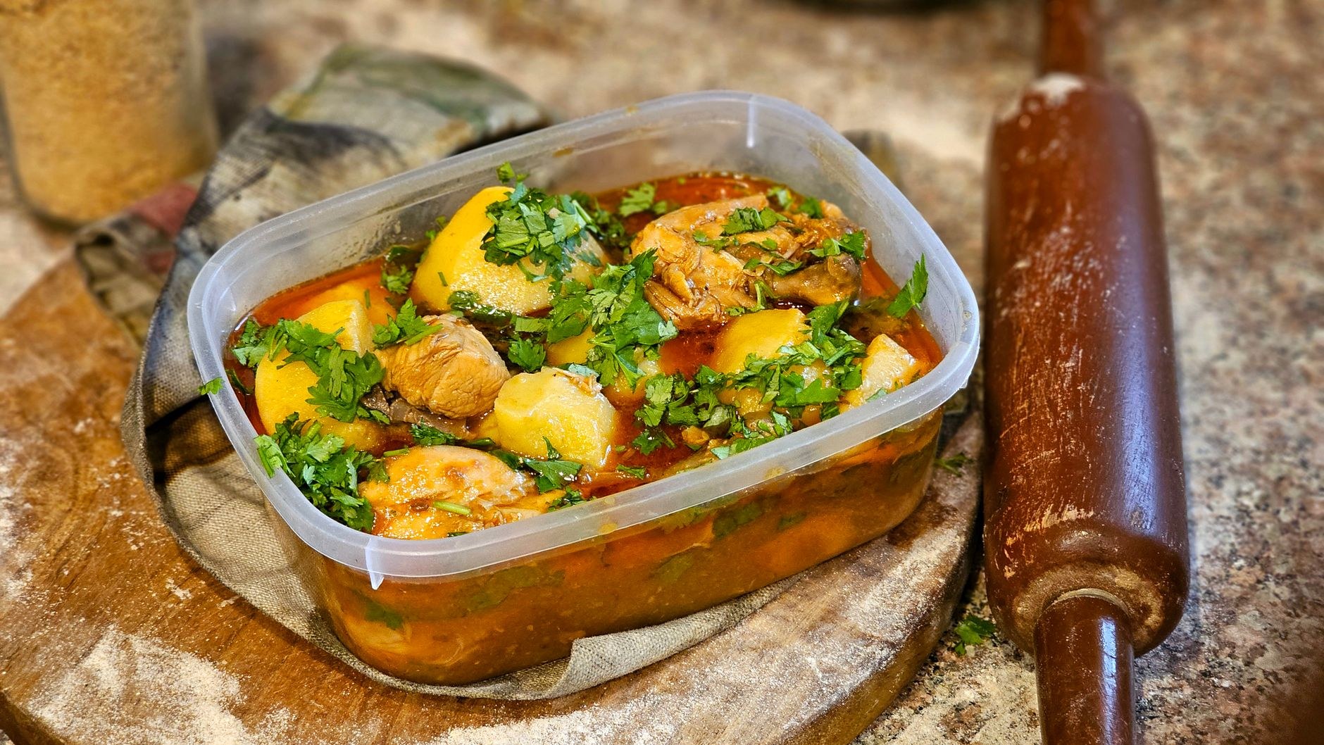 A hearty one-pot Caribbean stew of breadfruit, callaloo leaves, dumplings, and meat simmered in coconut milk
