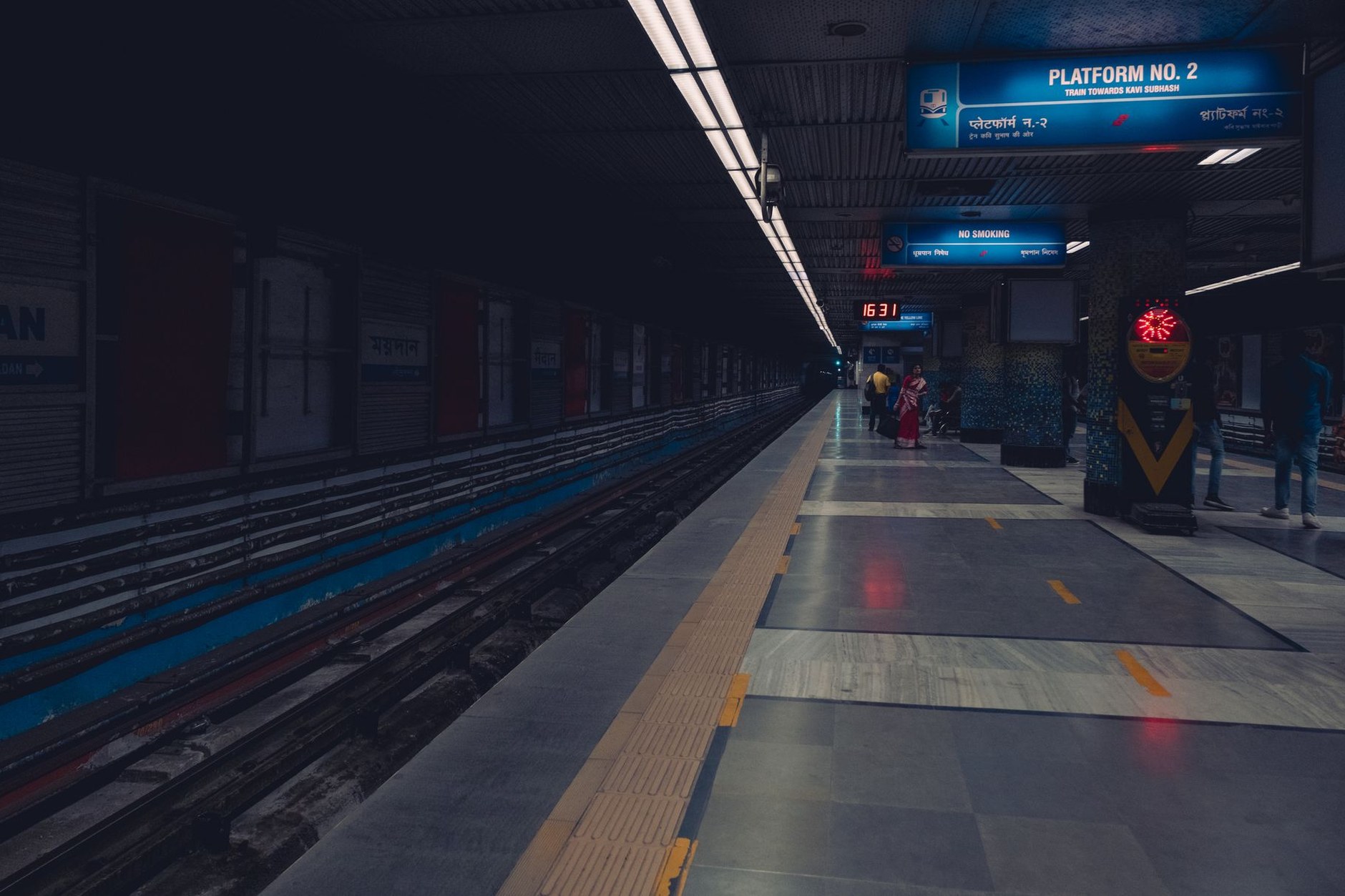 Modern air-conditioned passenger train on the elevated Delhi Metro system
