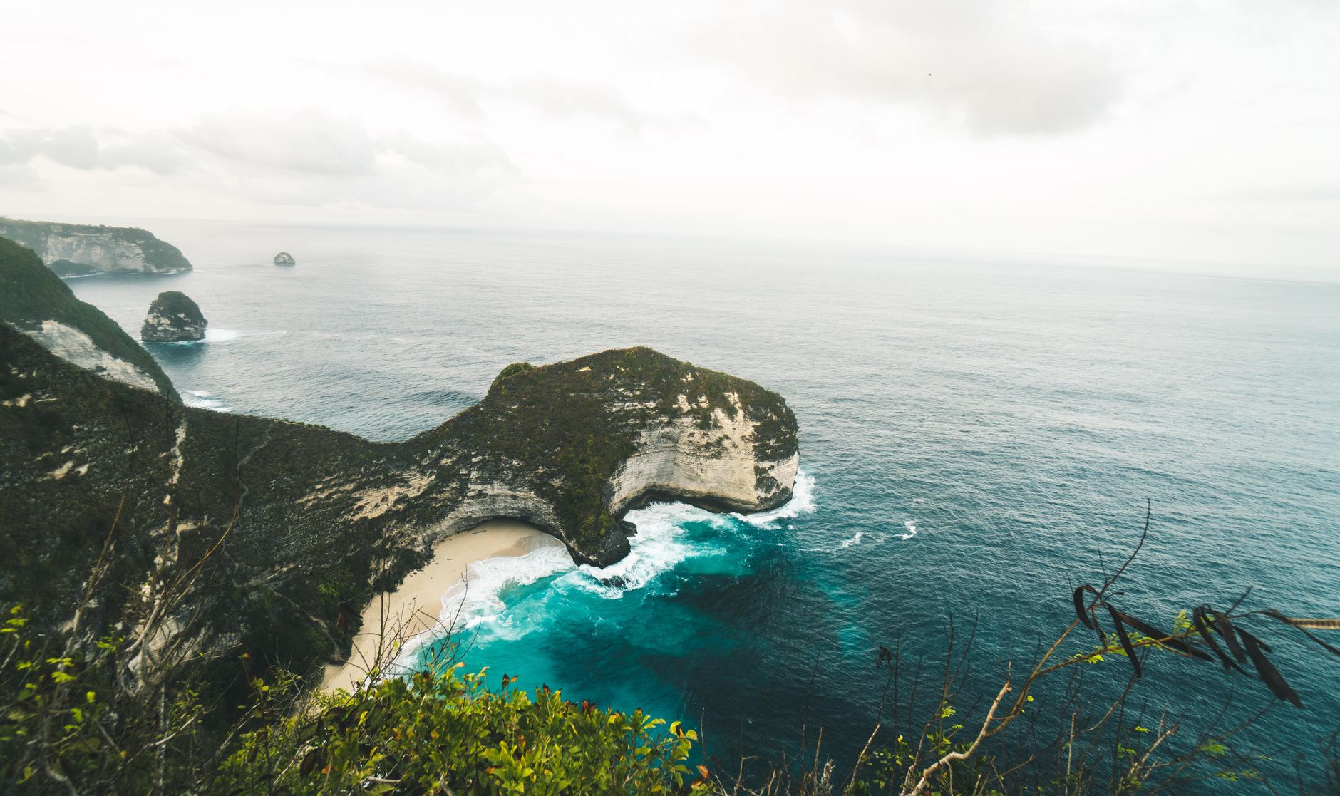 Dramatic limestone cliffs and turquoise water of Nusa Penida