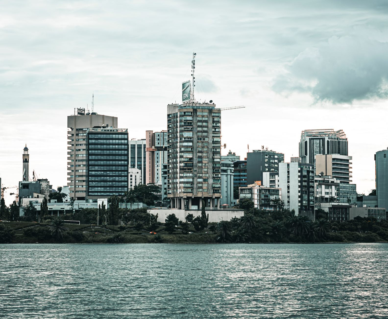 Modern skyscrapers of the Plateau business district rising along the Ebrie Lagoon in Abidjan