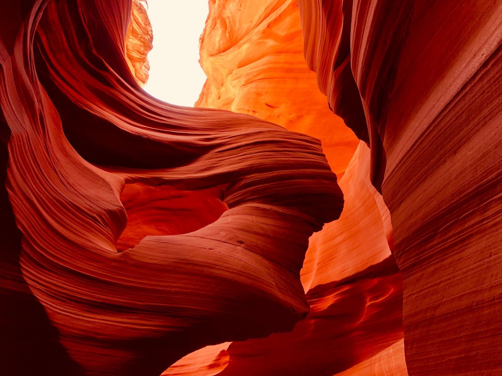 Towering red sandstone cliffs and dramatic eroded rock towers of the Valley of Castles in Charyn Canyon